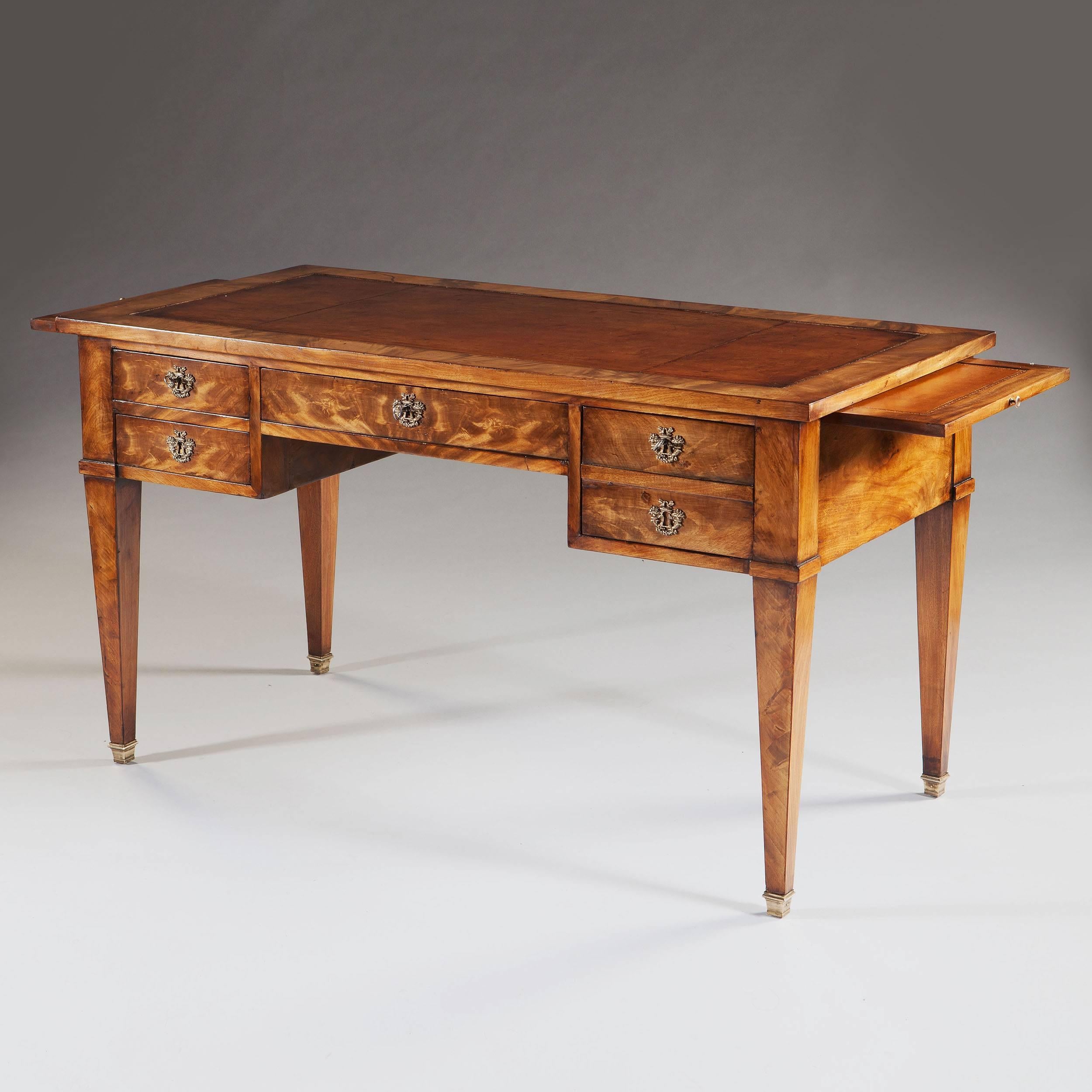 An early 19th century Directoire period mahogany bureau plat, having leather lined writing surface and a pair of slides. 

Width fully extended 183cm.