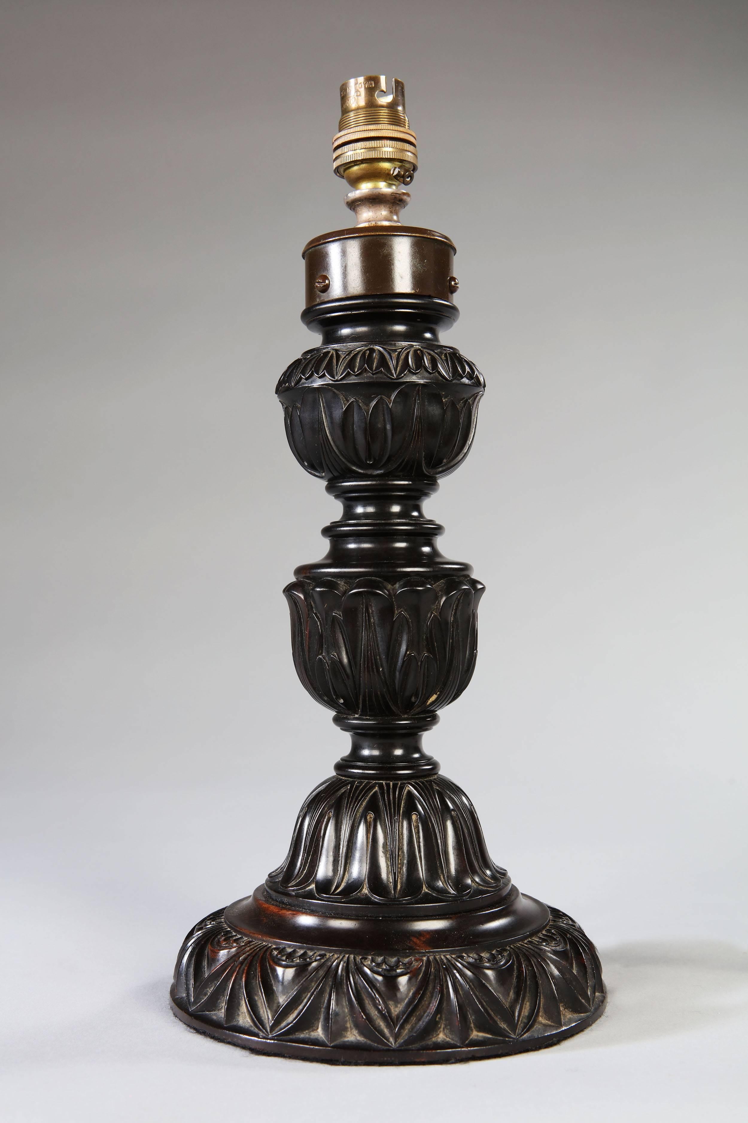 A mid-19th century Anglo Sinhalese carved ebony lamp.