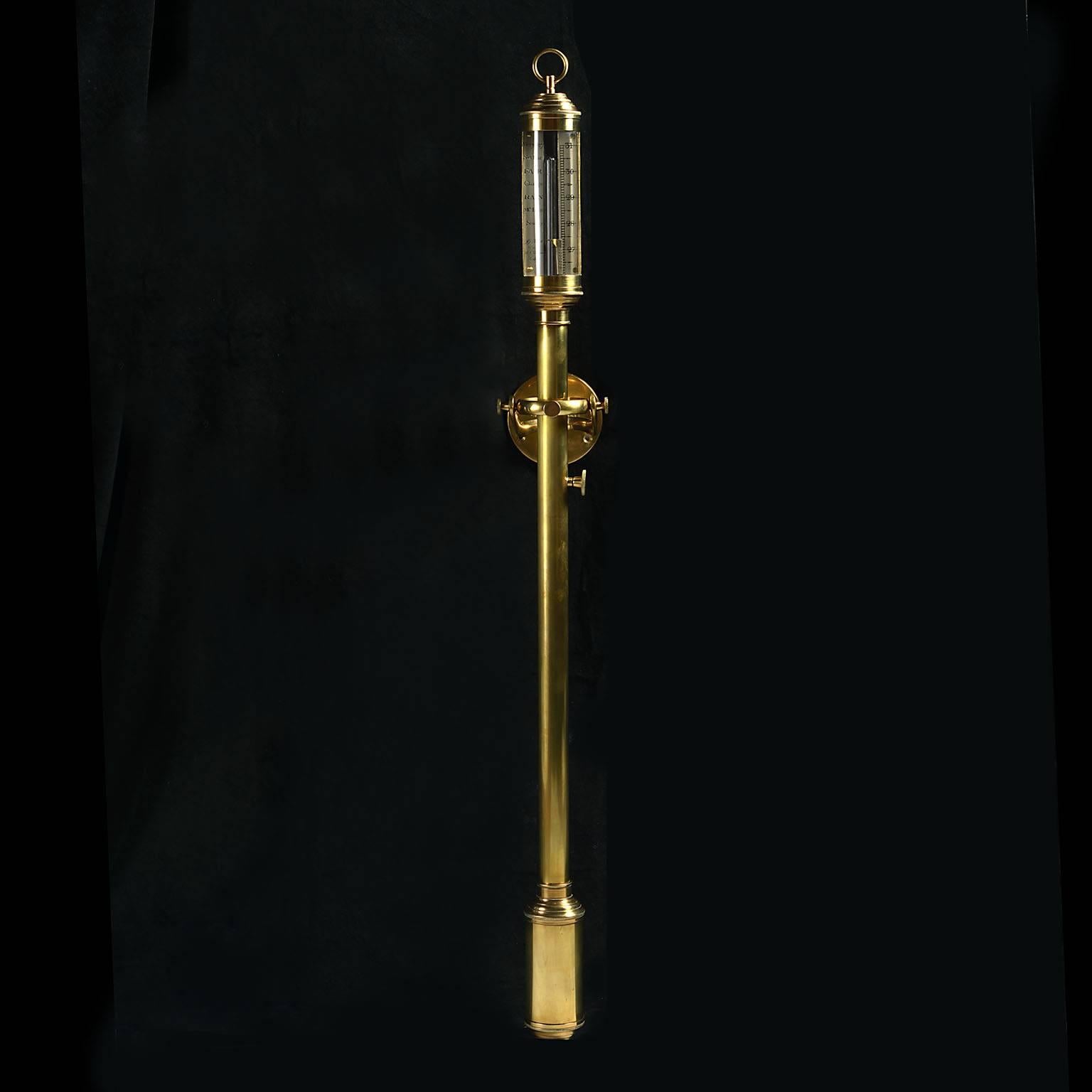 An unusual mid-19th century polished brass marine barometer mounted on a gimble, the steel face signed R.N.Desterre, Lisbon.