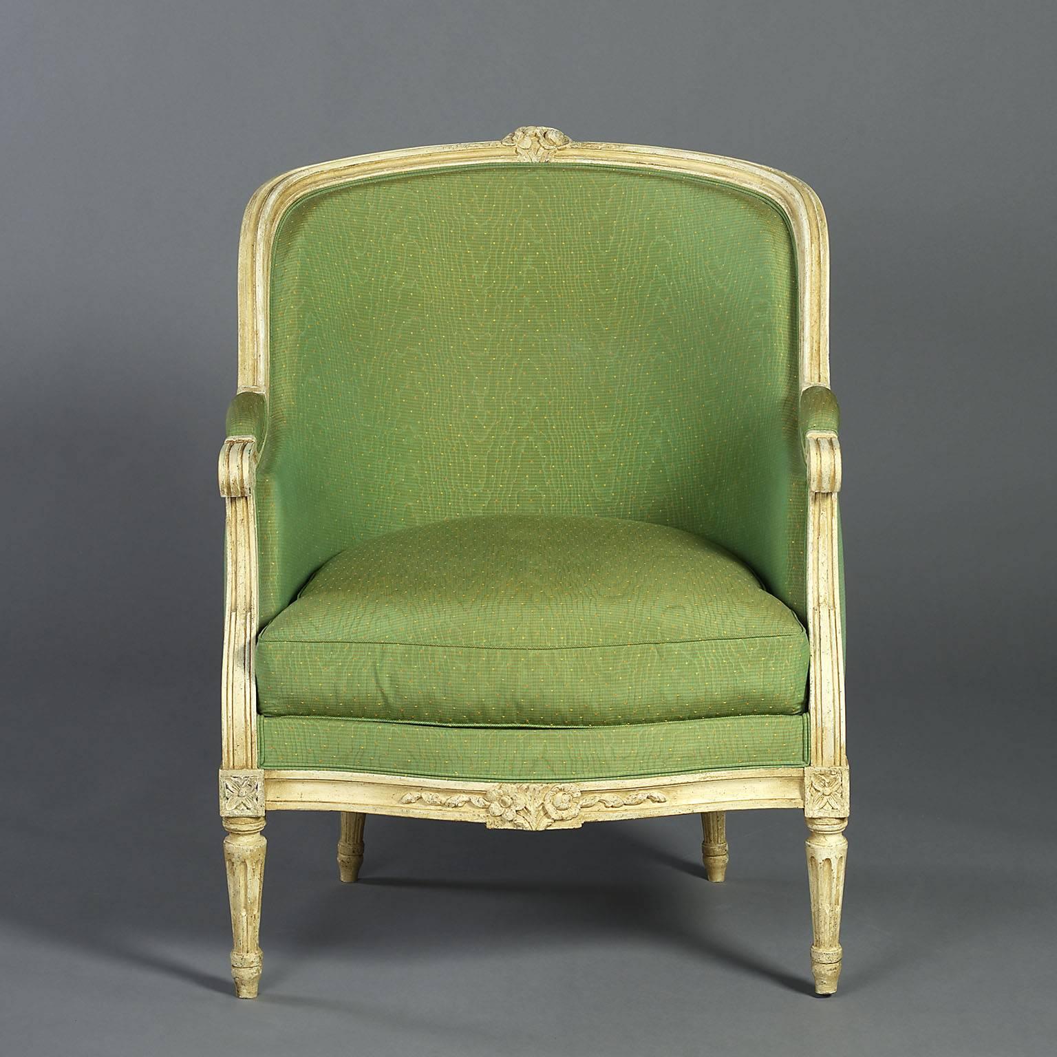 A pair of late 19th century painted bergère of good scale with curved backs, supported on tapering fluted legs with carved paterae.