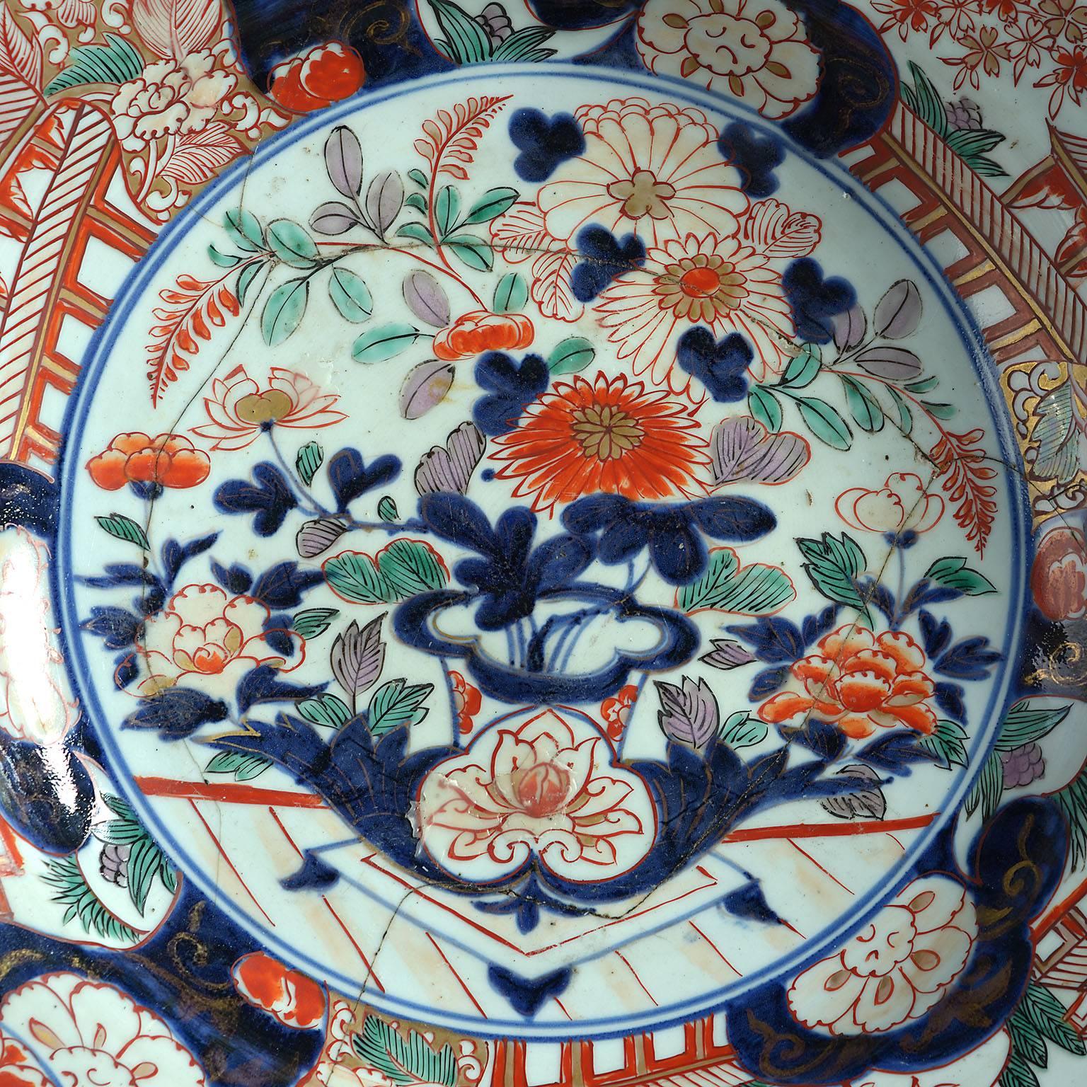 A fine mid-18th century overscale Imari charger decorated with foliate designs and pavilions. With restorations.