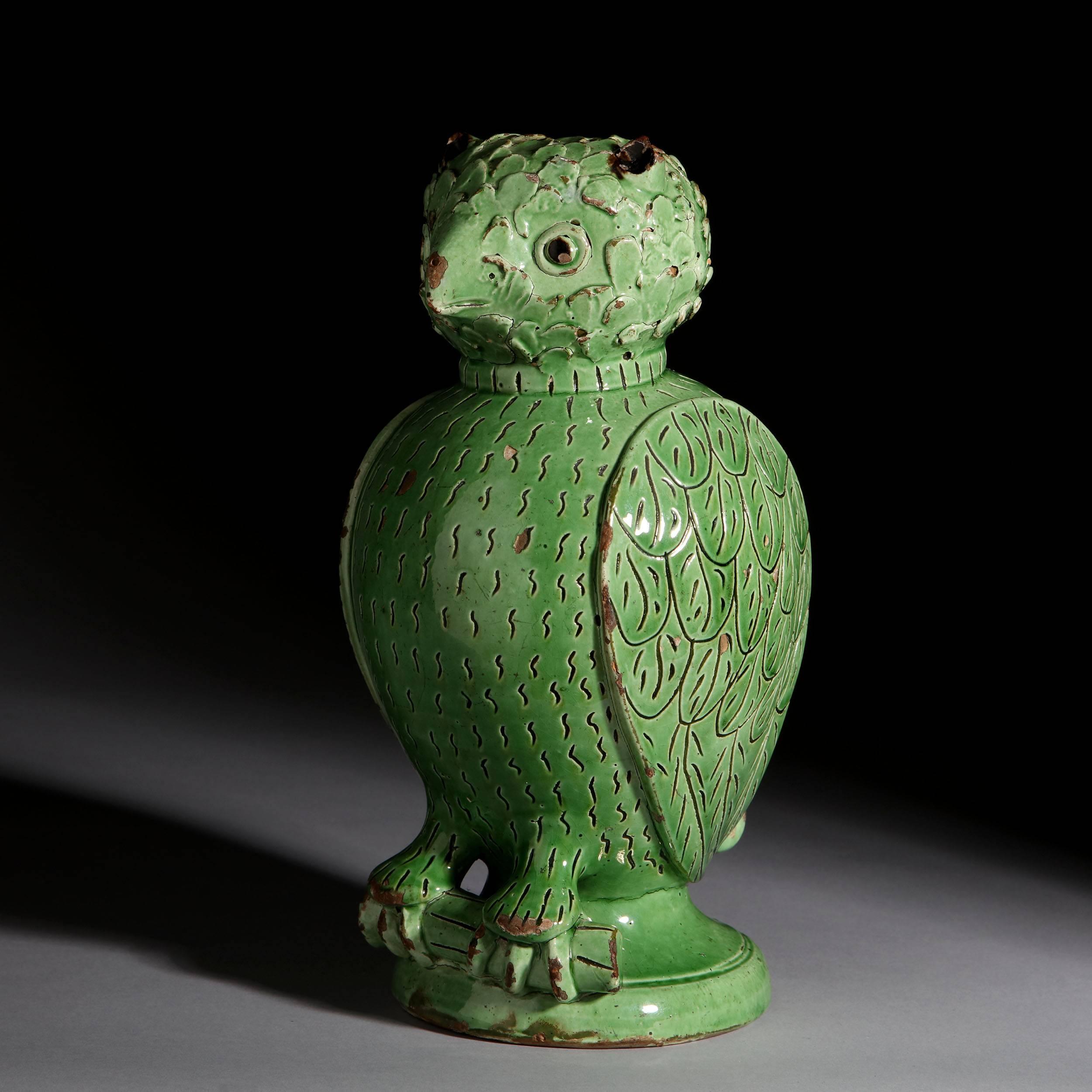 A rare early 19th century Skotterup pottery owl with green glaze, by Johan Stodl (1820-1899).
