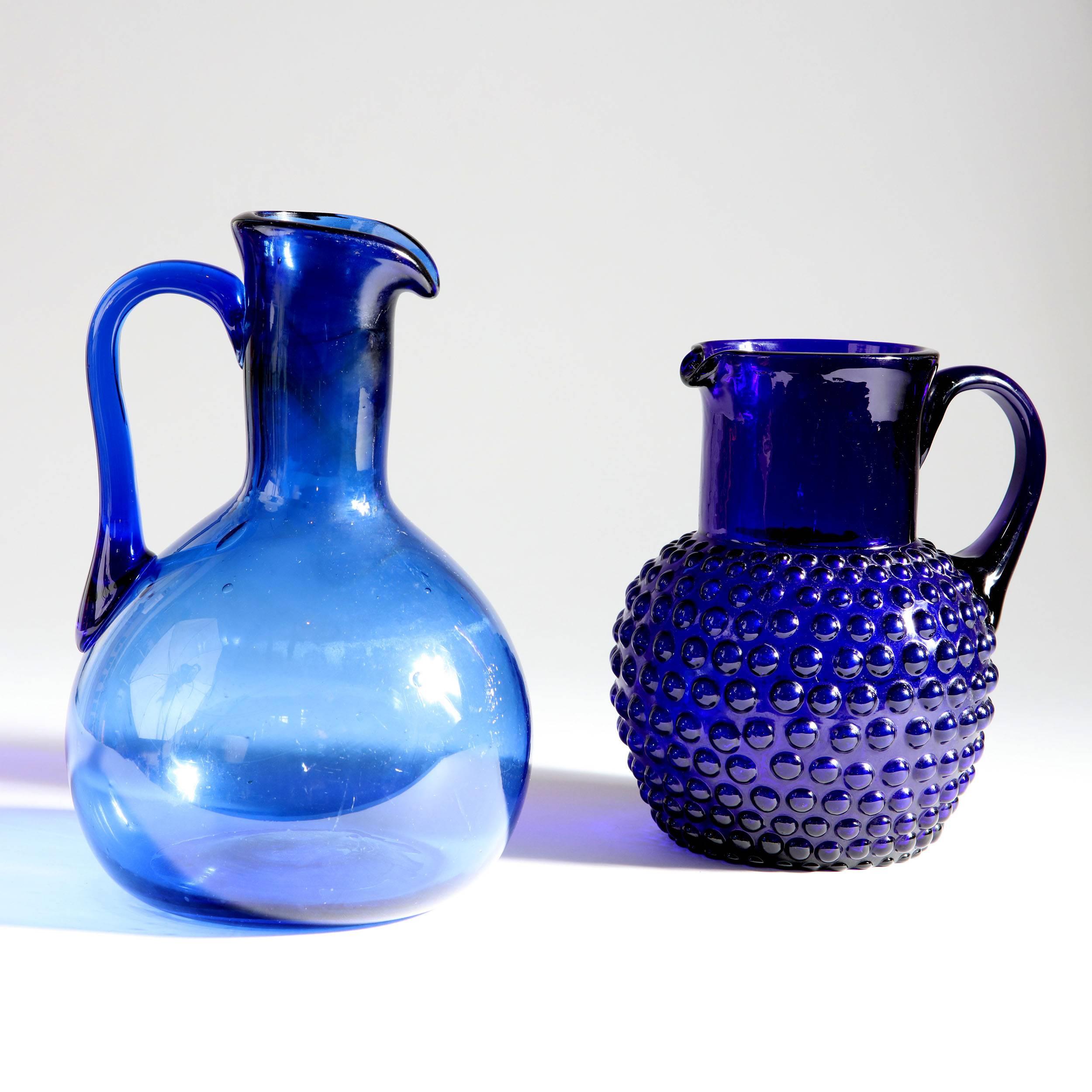 A late 19th century Bristol blue glass jug with circular bobble decoration to the body.