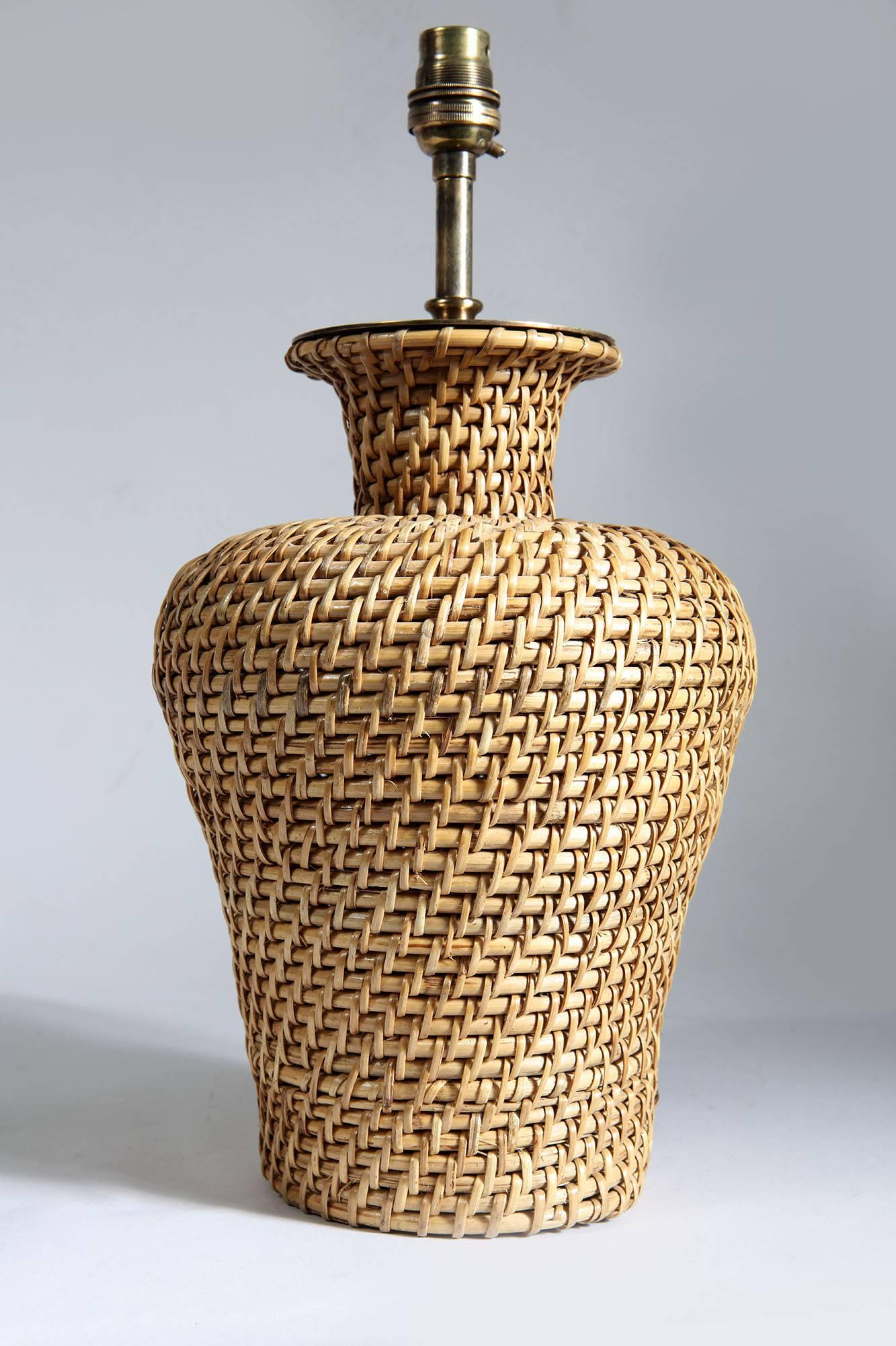 A pair of rattan straw weaved vases now converted to lamps.