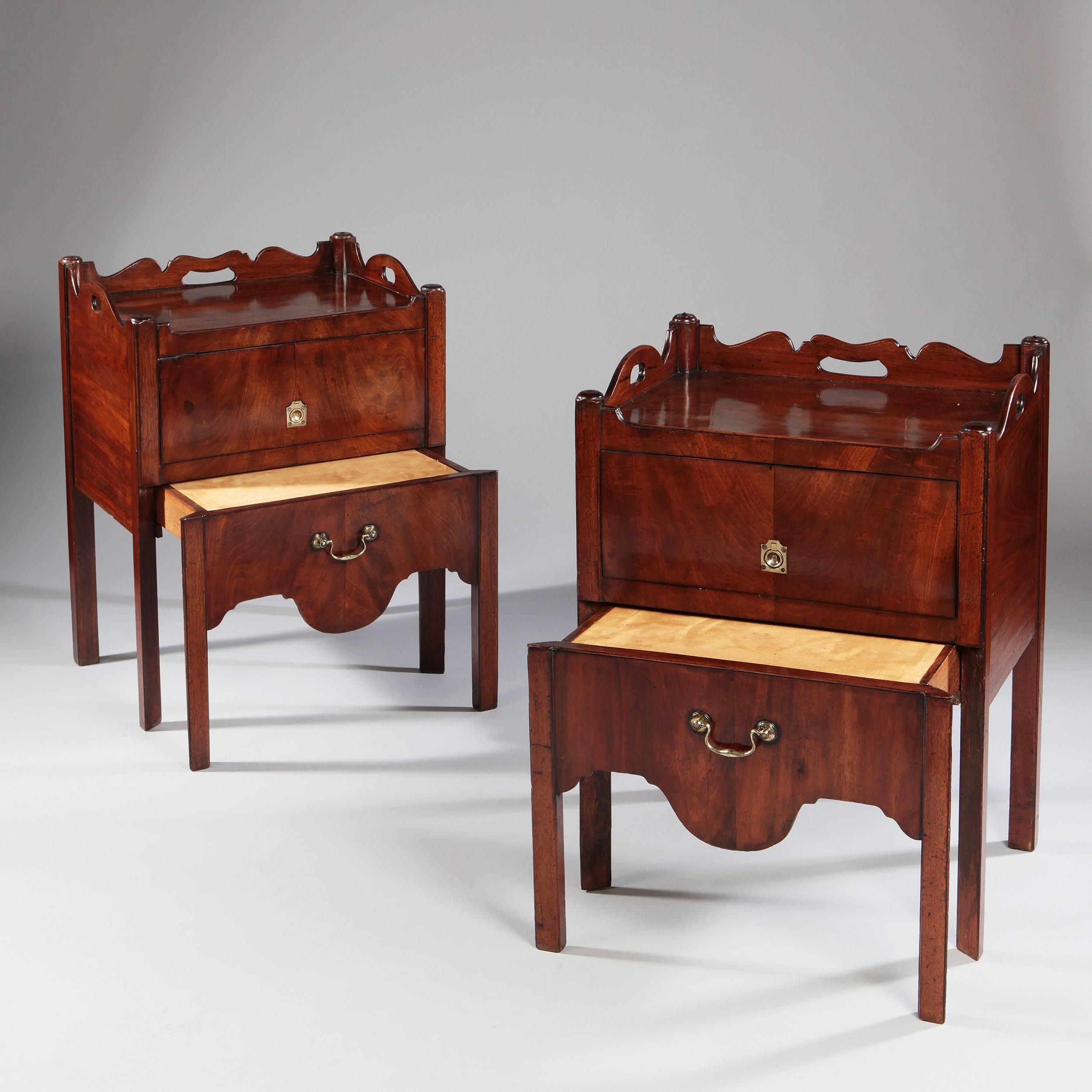 A matched pair of mid-18th century mahogany tray top bedside commodes of generous scale.