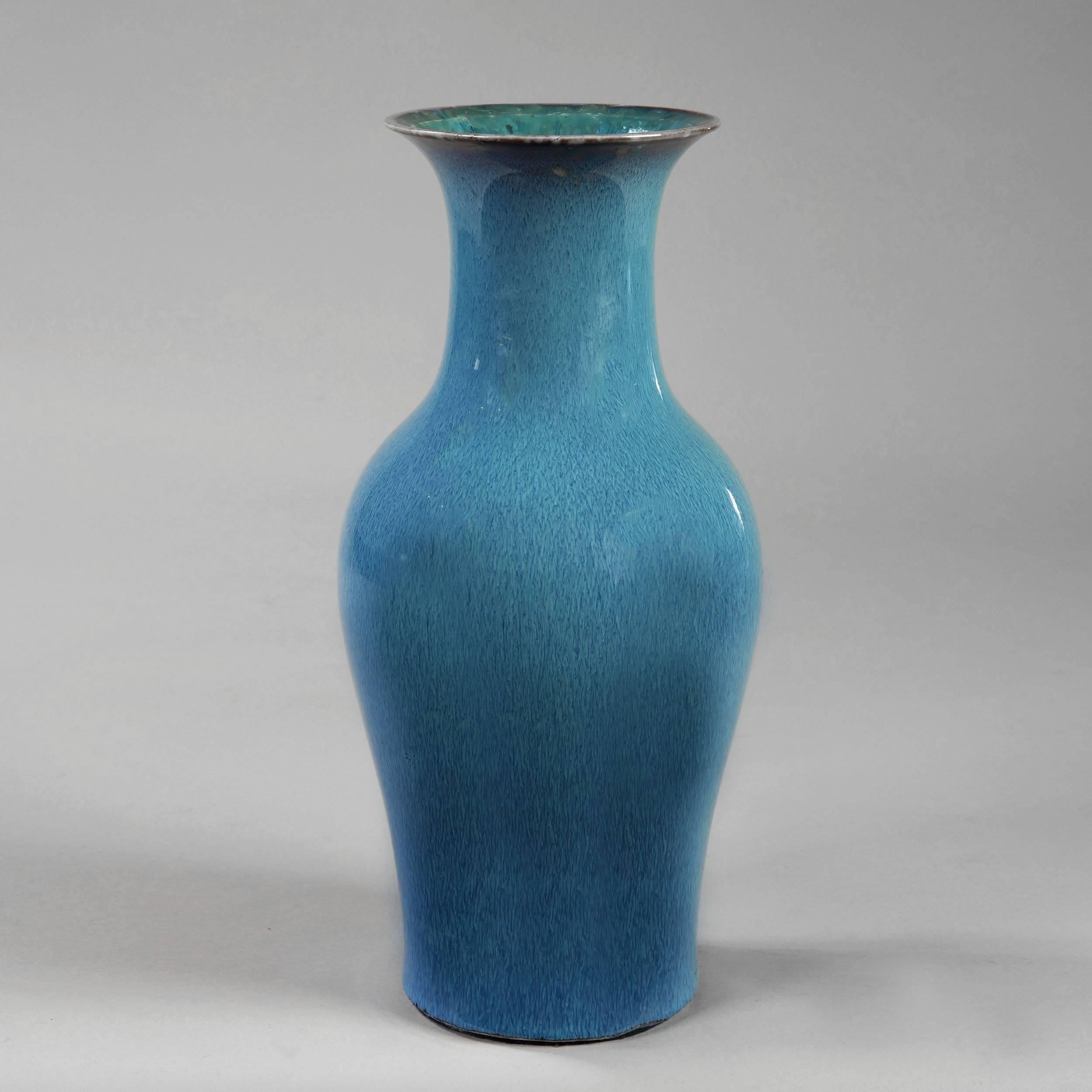An early 20th century bird’s-eye blue glaze baluster vase.