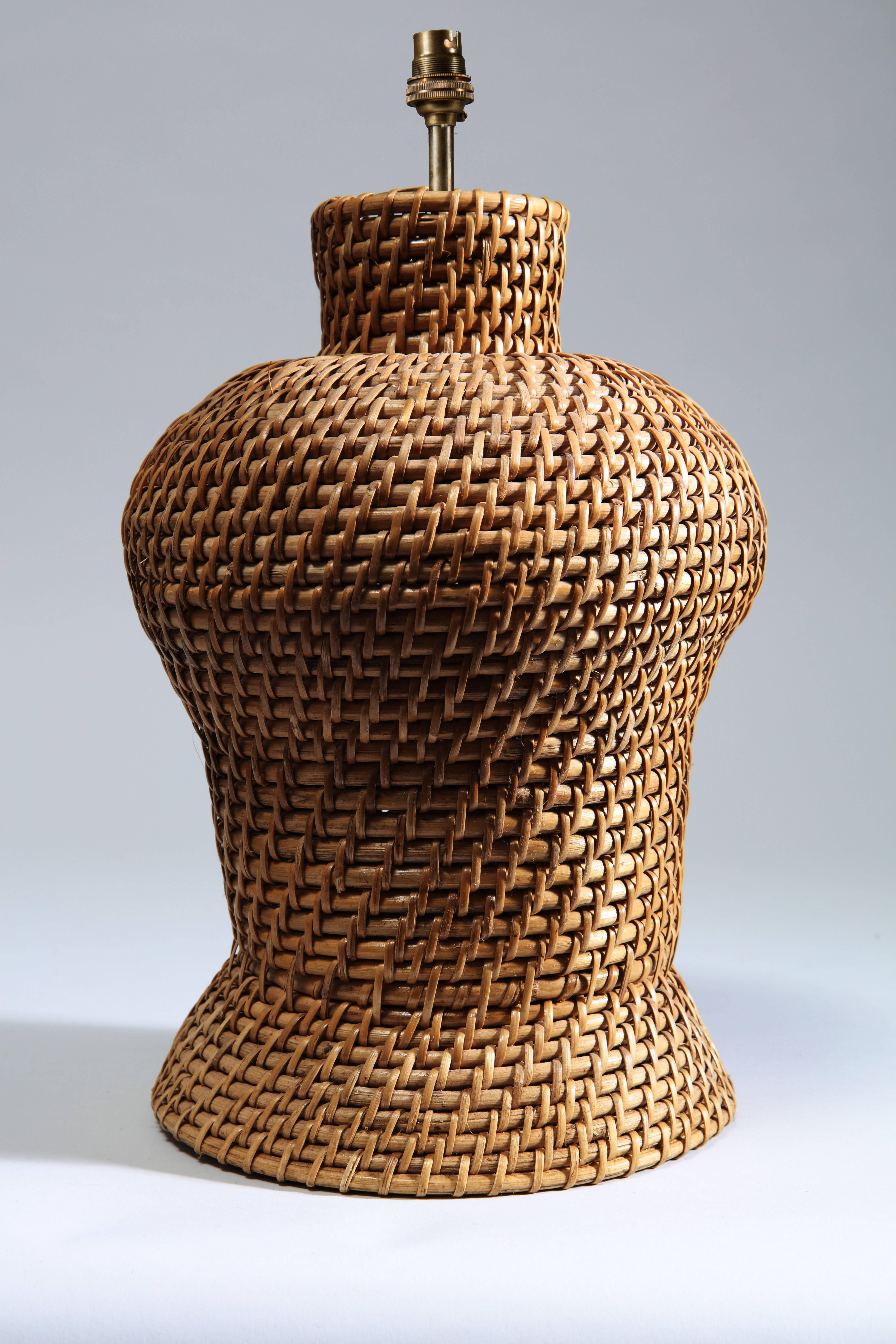 A pair of rattan straw weaved vases now converted to lamps.