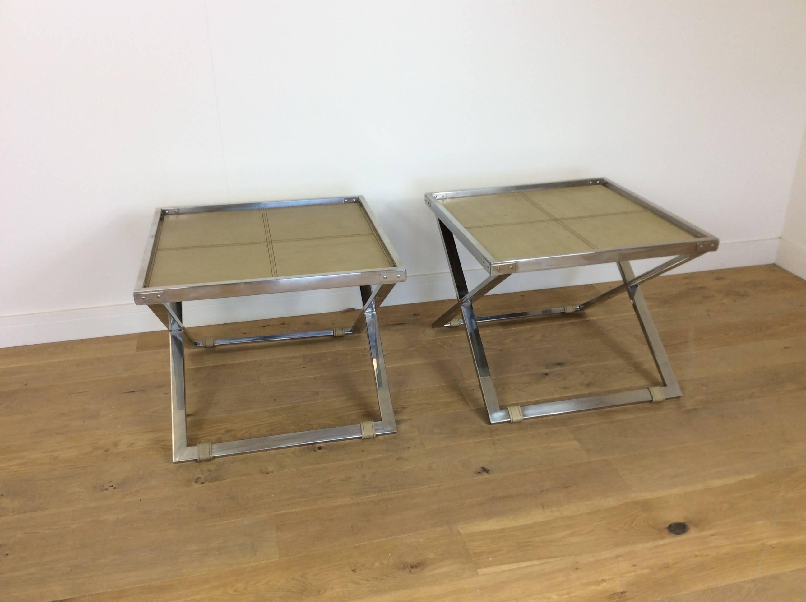 Mid-Century Modern design.
A pair of midcentury X-frame butlers tables, thick heavy flat chrome frames with inset shagreen tops.
Excellent quality to these designer tables
French, circa 1960.
Measure: 55 cm H, 70 cm sq.