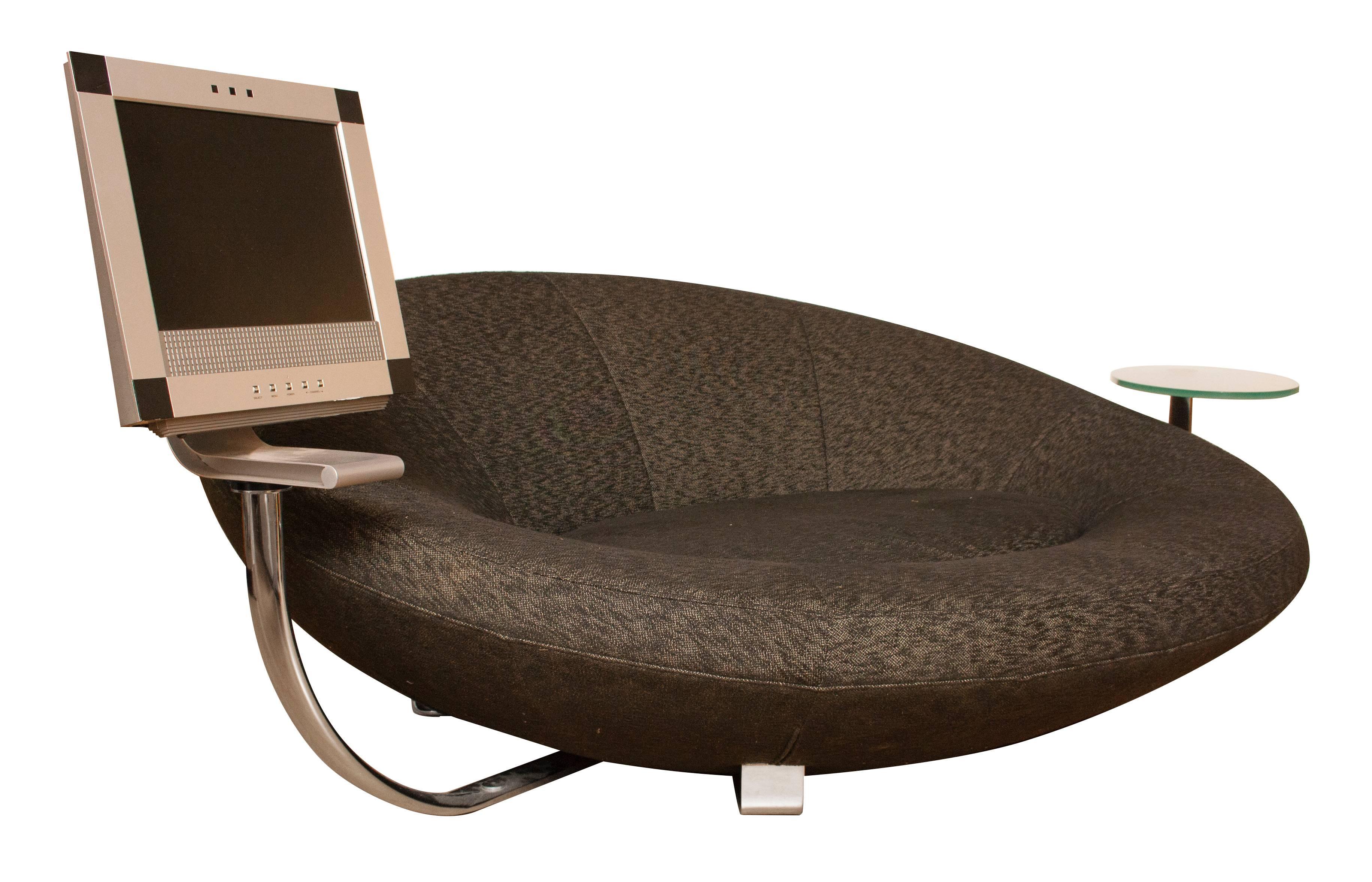 Midcentury large oval sofa.
Very impressive large oval sofa raised on chrome brackets, with removable side table and monitor.
The brackets that carrie the monitor and side table can be separately removed by unscrewing each bracket at the