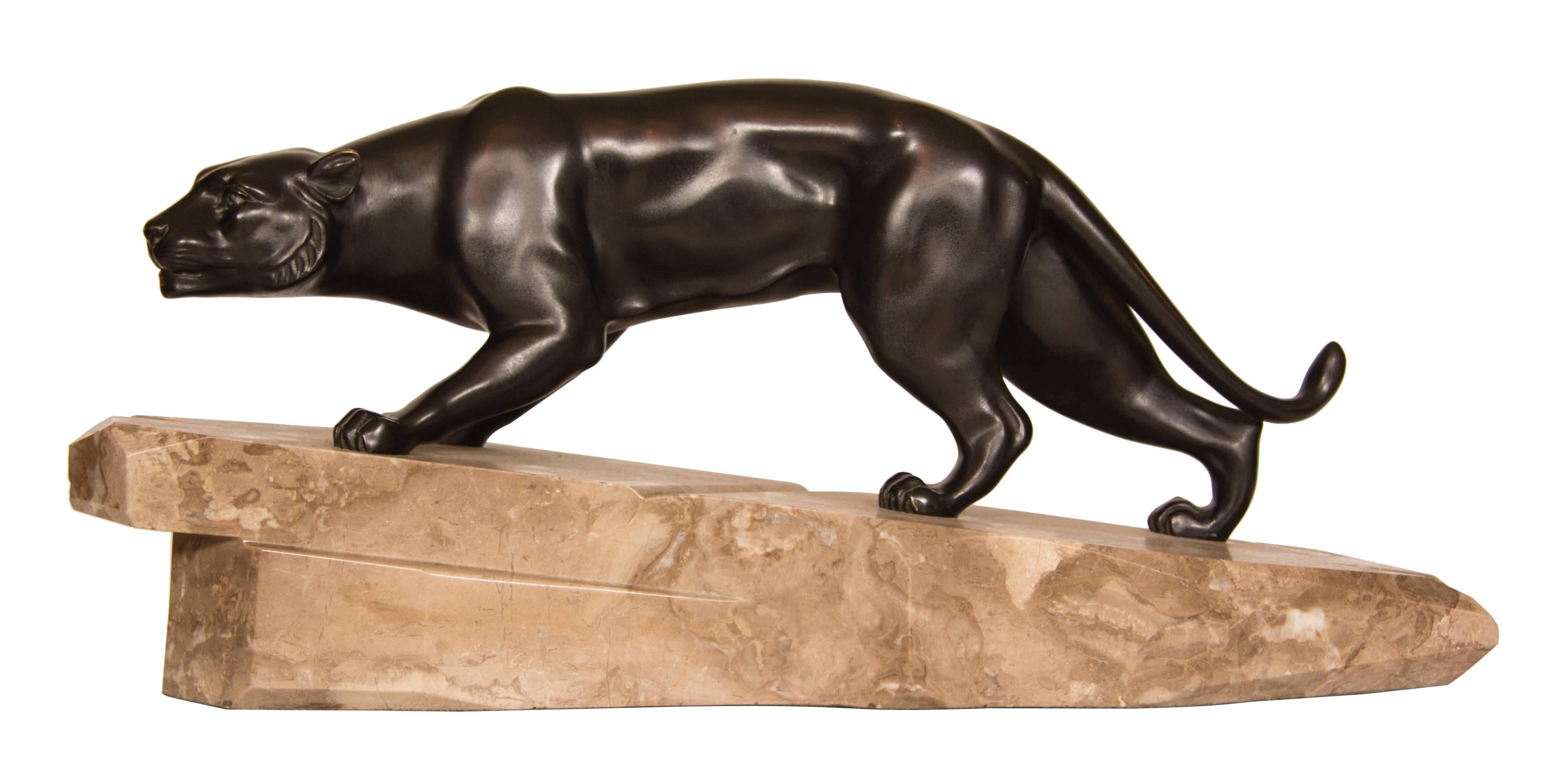 An Art Deco bronze model of a prowling panther on a mountain rock.
Signed in the marble J Brault
Measure: 25 cm H x 56 cm W x 17 cm D
French, circa 1930.