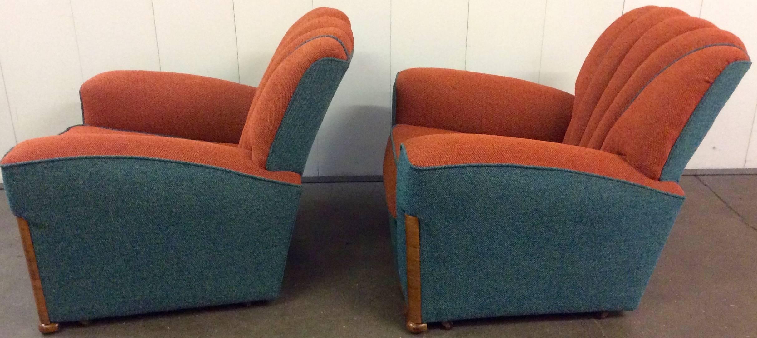 Beautiful Art Deco shell back pair of armchairs, smartly re upholstered in a contrasting Moquette fabrics. Walnut trims. Measures: Chairs 82 cm H, 92 cm W, 94 cm D, seat is 41 cm H 61 cm D.
British, circa 1930.
