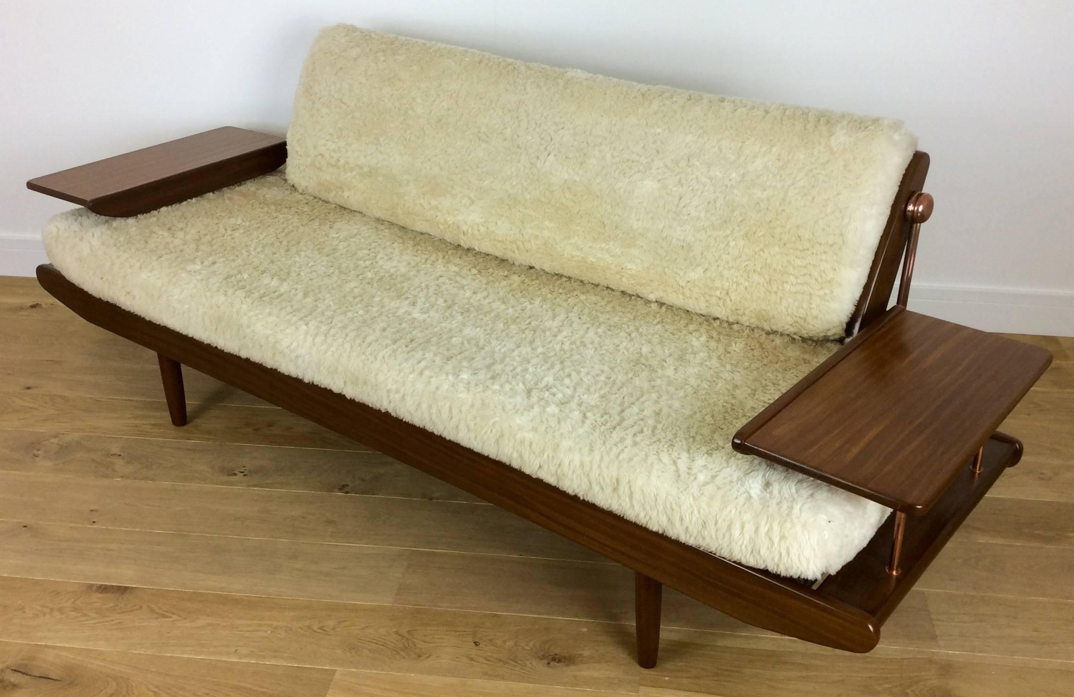 Mid-Century Modern design sofa bed.

A very rare 1950s sofa daybed produced by highly esteemed British manufacturer toothill.

A very beautiful piece of mcm furniture upholstered in luxury soft lambs wool.

Constructed using a combination of