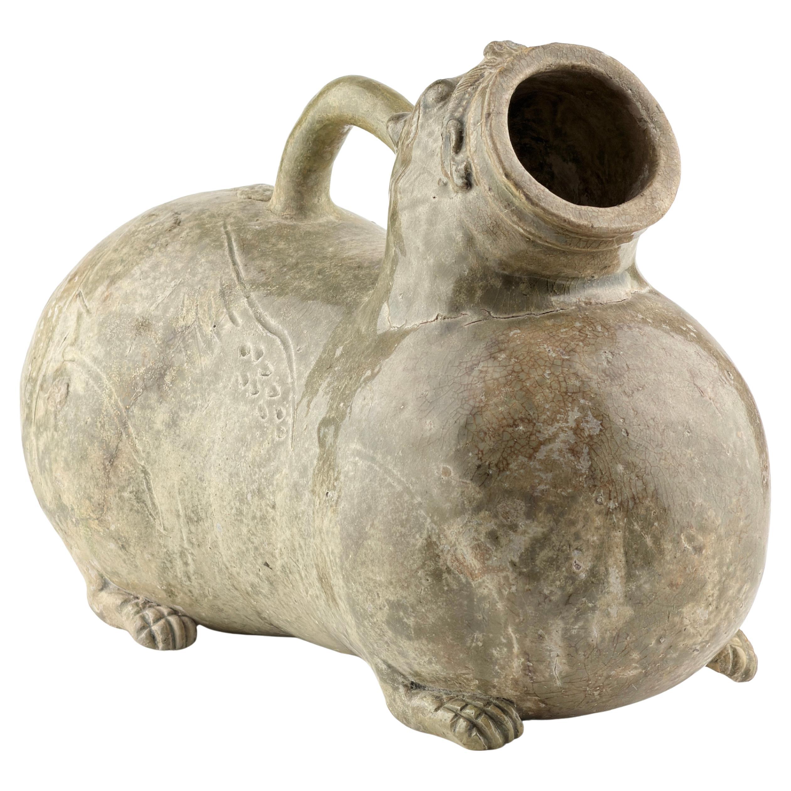A Rare Yue Celadon-Glazed Figural Vessel, Western Jin dynasty (265-420)