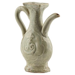 A Molded Longquan Celadon
Fu Shou
Ewer, Ming Dynasty Antique A Molded Longquan Celadon
Fu Shou
Ewer, Ming Dynasty