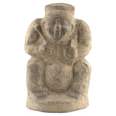 Figura de cerámica de un tamborilero sentado