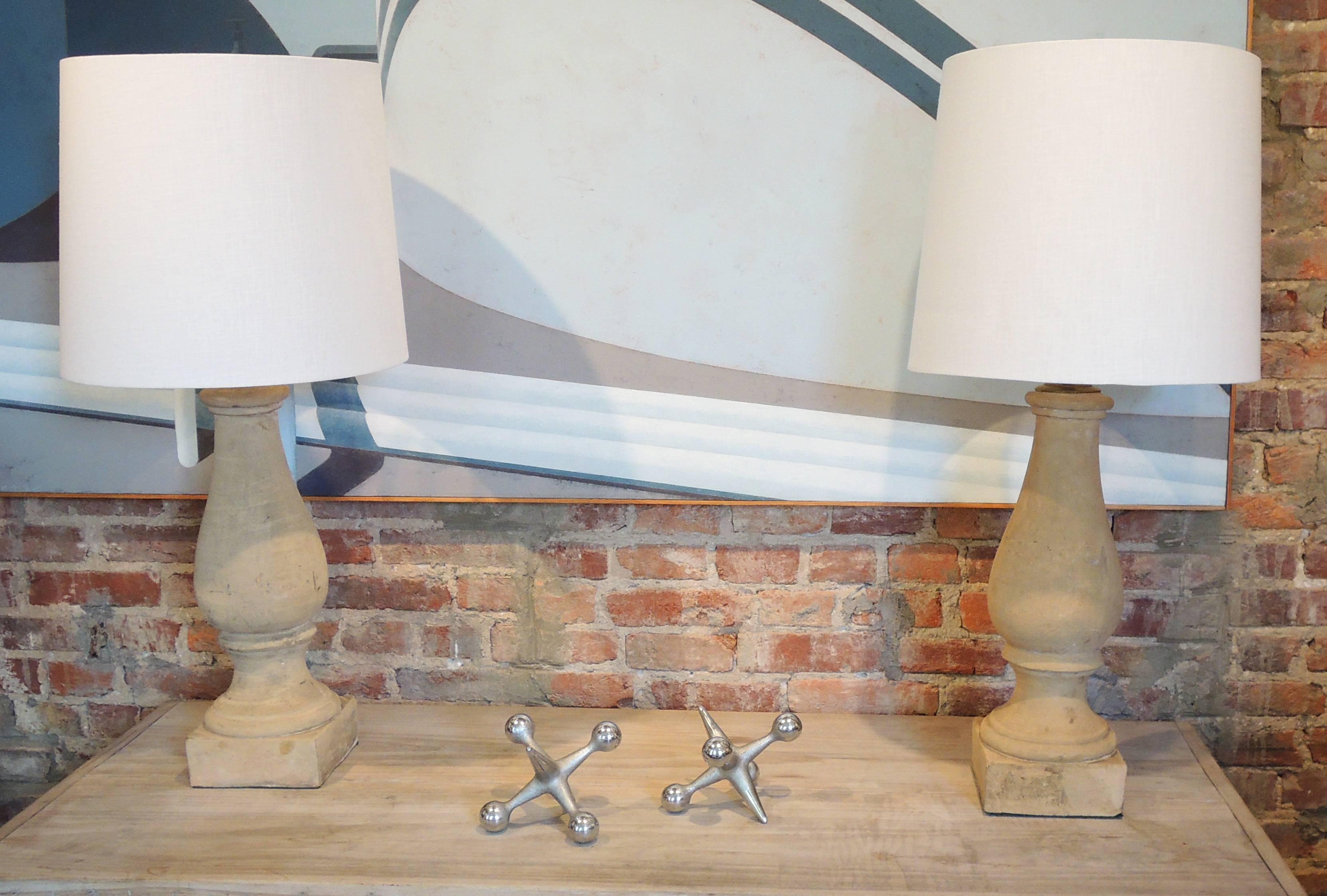 Distinctive pair of lightly colored terra cotta balusters made into table lamps.
(ht with shade 34