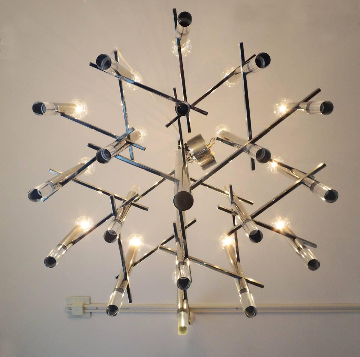 Stunning suspension designed by Gaetano Sciolari, circa 1960. Beautiful, quality manufacture. This design has 15 lights, 18 Lucite tips. May be used with round or oval candelabra bulbs. This example in perfect shape. No cracks.