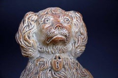 Antique Salt Glaze Pottery Spaniel Seated on Oval Base, circa 1835 Derbyshire UK