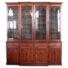 Gothic Revival Oak Breakfront Bookcase with decorated glass panels in the doors