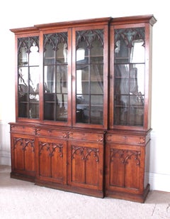 Gothic Revival Oak Breakfront Bookcase with decorated glass panels in the doors