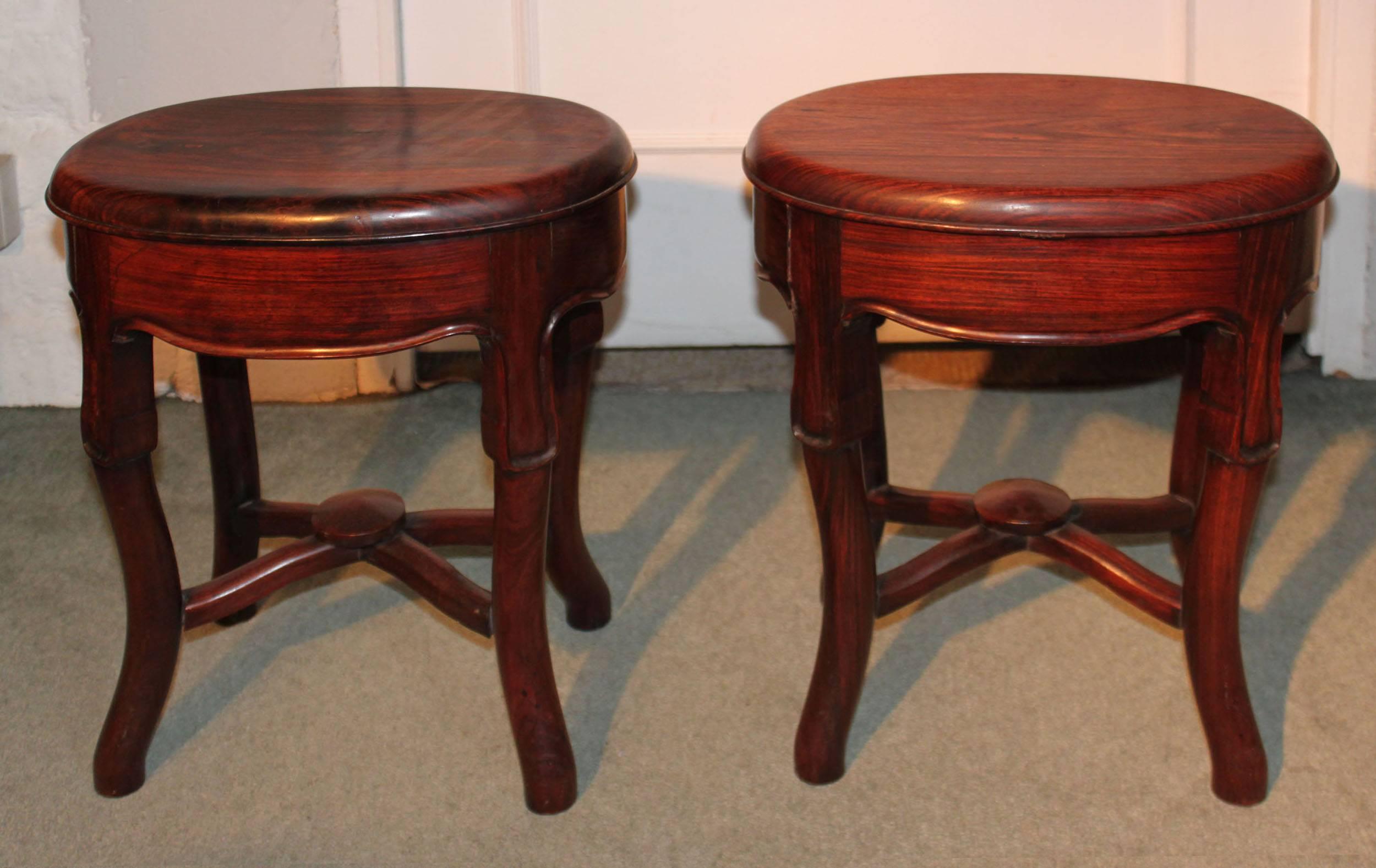 A pair of late 19th century Chinese stools in huang huali wood which is similar to padouk.

 