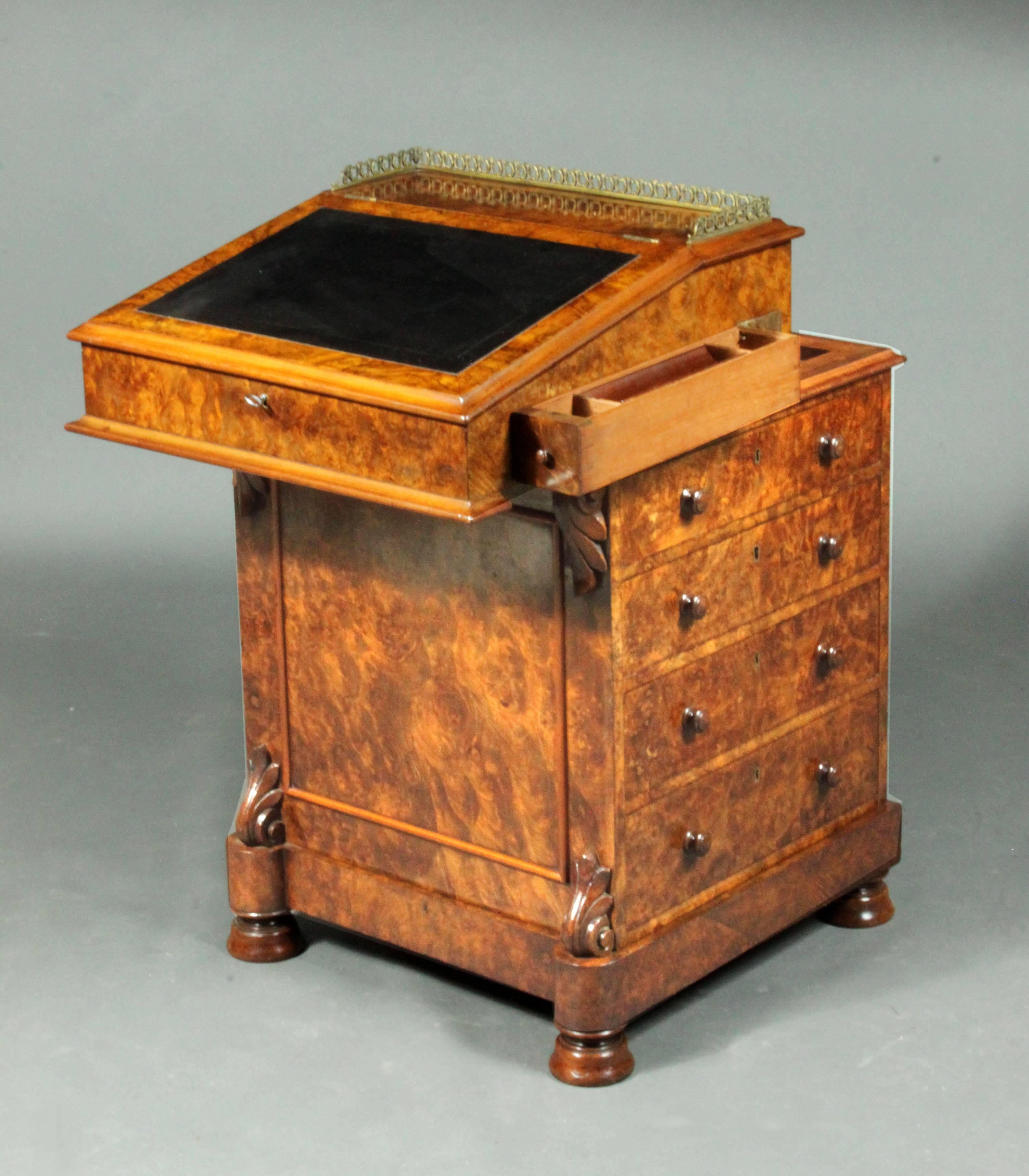 A fine early Victorian Davenport in burr walnut of good color and patina, with fitted interior in bird's-eye maple; ink drawer and drawers on the right side and false drawers on the left; the drawers with VR locks, good paneled back - in very good