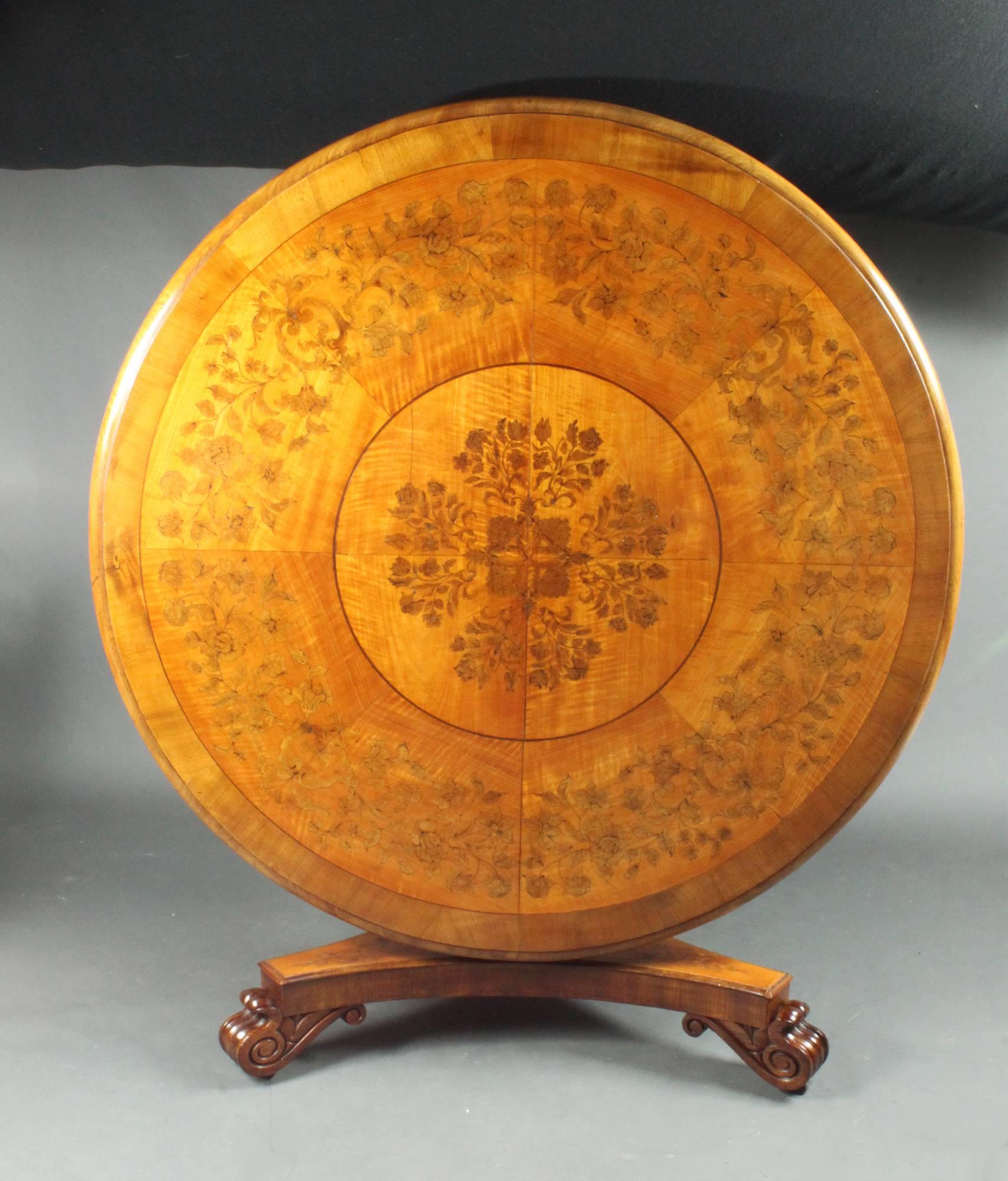 A fine William IV satinwood centre table with attractive marquetry inlay to the top and base.


