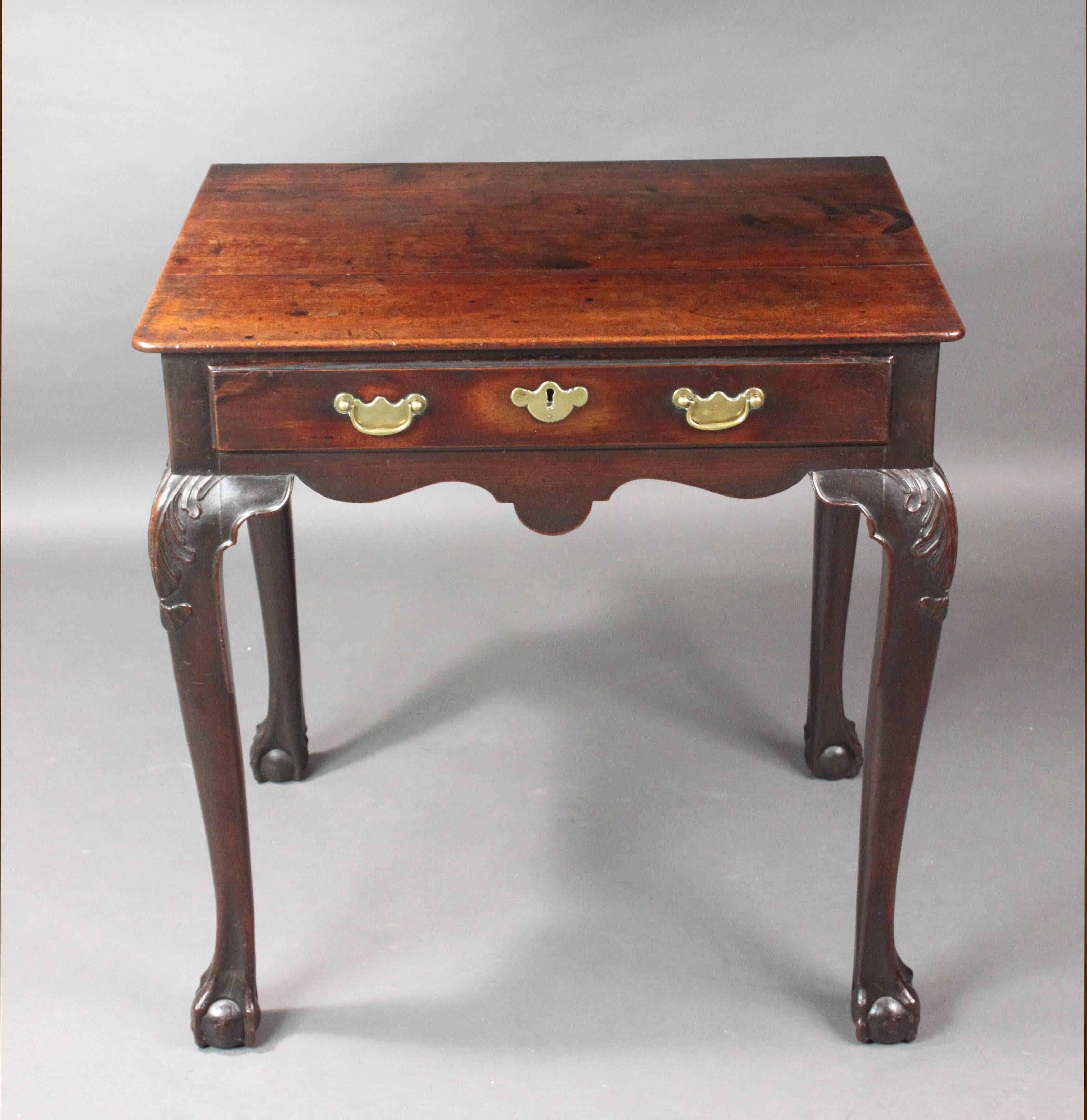 A most attractive mid-18th century Irish side table in red walnut of a good original color, patina and condition. Cabriole legs with carved acanthus leaves and ball and claw feet, shaped frieze and original brasses.
 

   