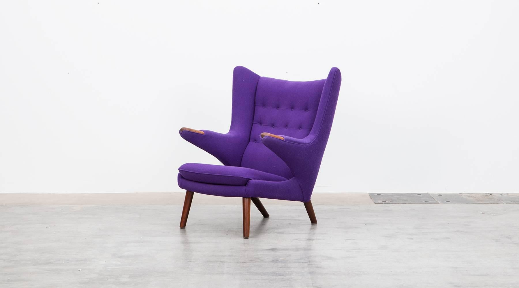 Wonderful original Papa Bear Chair designed by Hans Wegner. It is in perfect condition although the wood is reworked. It comes in shining purple wool fabric. The legs and nails are teak. Manufactured by A.P. Stolen.