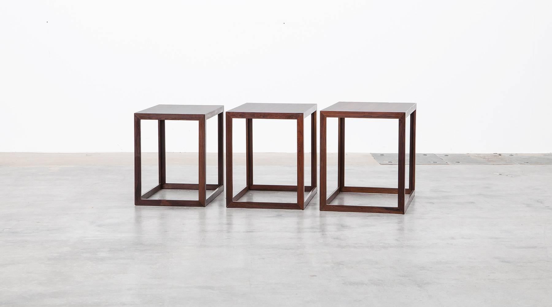 Elegant set of three nesting tables in the style of Børge Mogensen design. Each table has a rectangular top and even if there are differences in color shades and texture, the tables fits perfectly together. The wood is beautiful warm and shows a