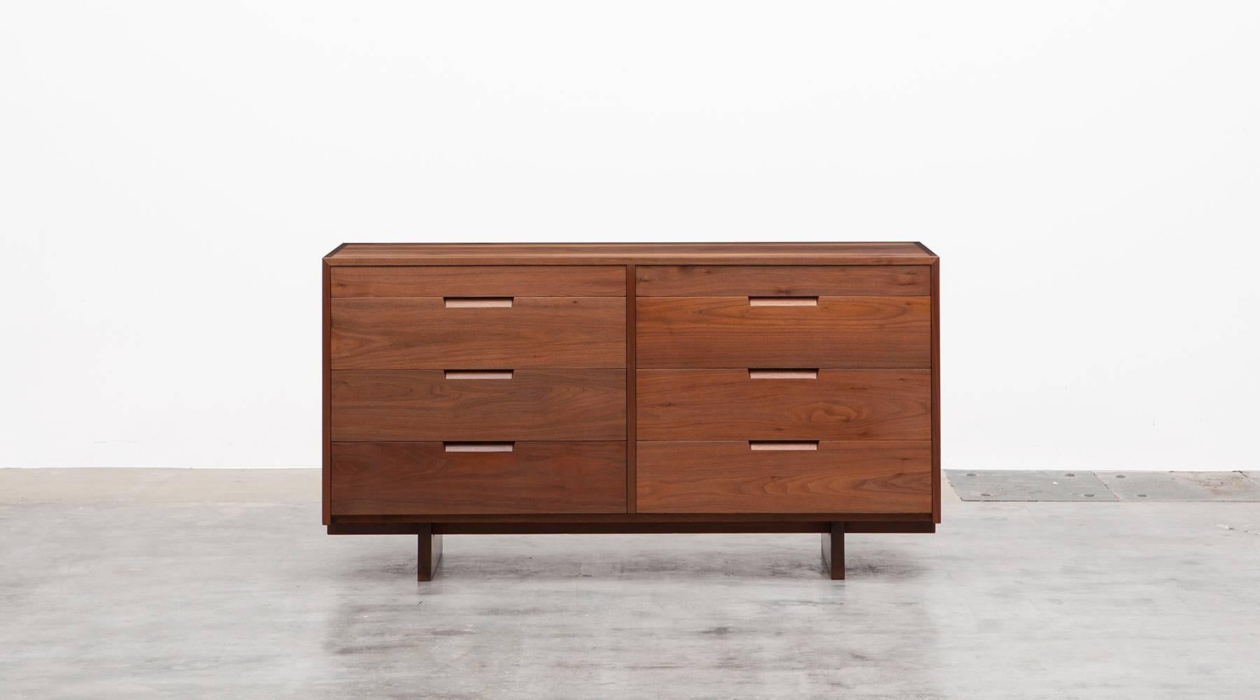 Handcrafted sideboard designed by famous American George Nakashima. It is constructed with American black walnut and contains six drawers with sufficient storage space. Graceful in proportion, it is one of the great examples of Nakashima's woodwork.