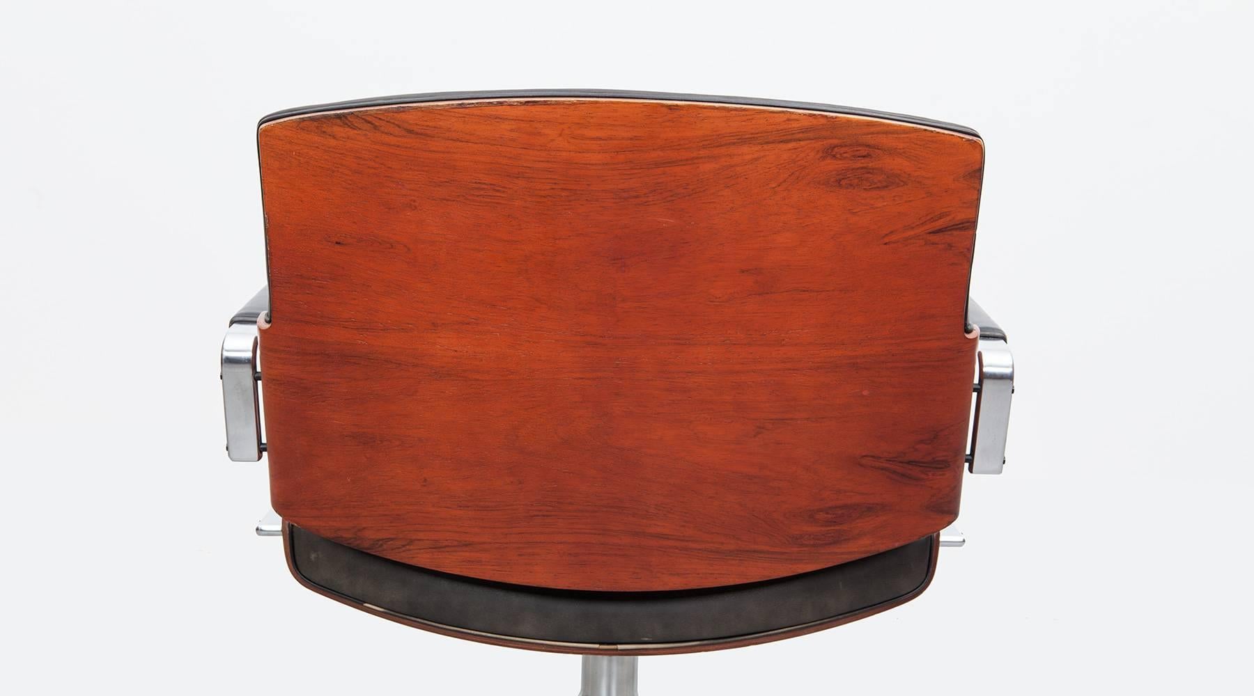 1960's brown wood and black leather Swivel Chair by Fabricius and Kastholm 'c' (Stahl)