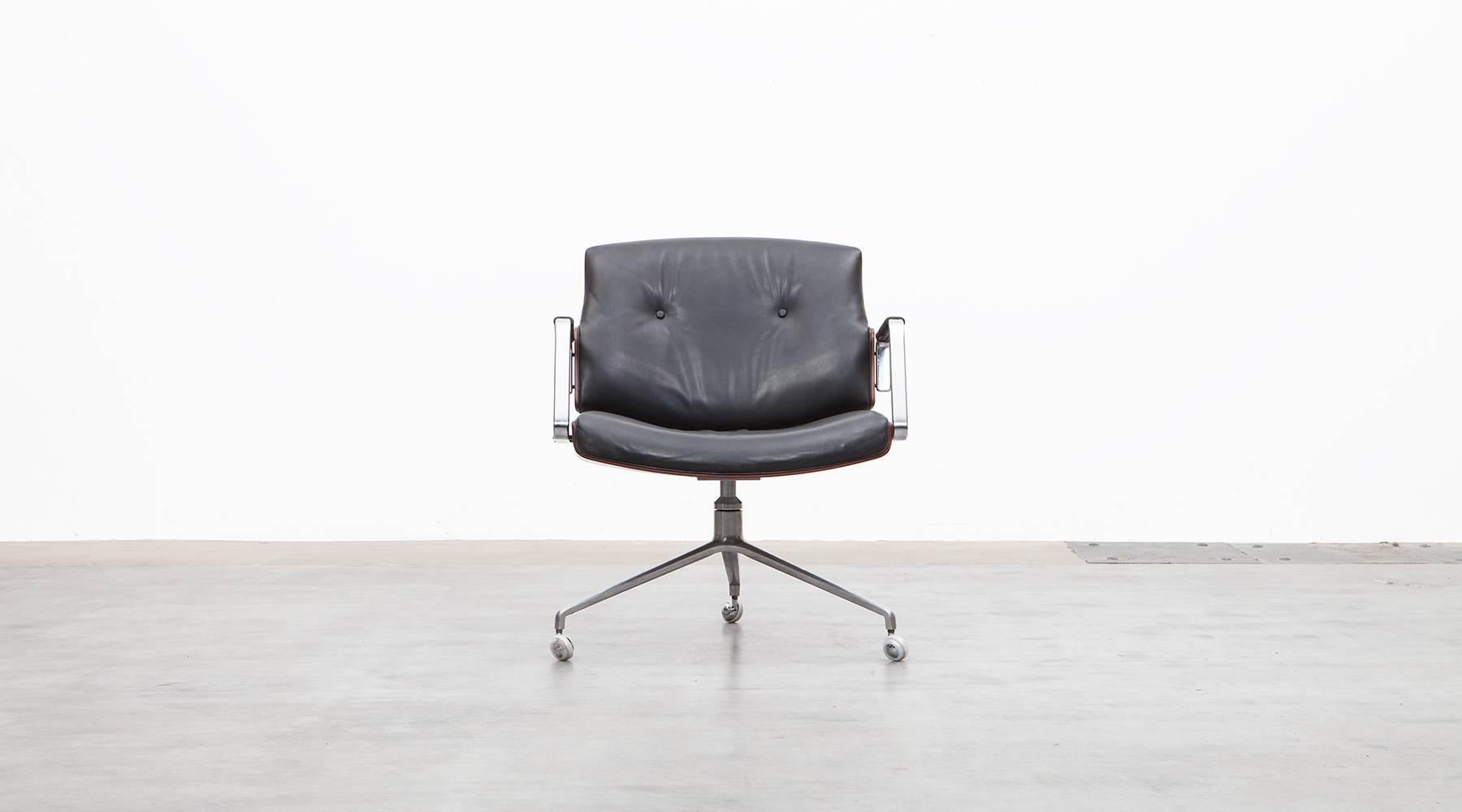 Black leather, Rosewood, Swivel Chair by Fabricius and Kastholm, Germany, 1968.

Classical swivel chairs designed by Preben Fabricius and Jørgen Kastholm. The chair has a brushed steel tripod foot, high quality-leather upholstery and two curved