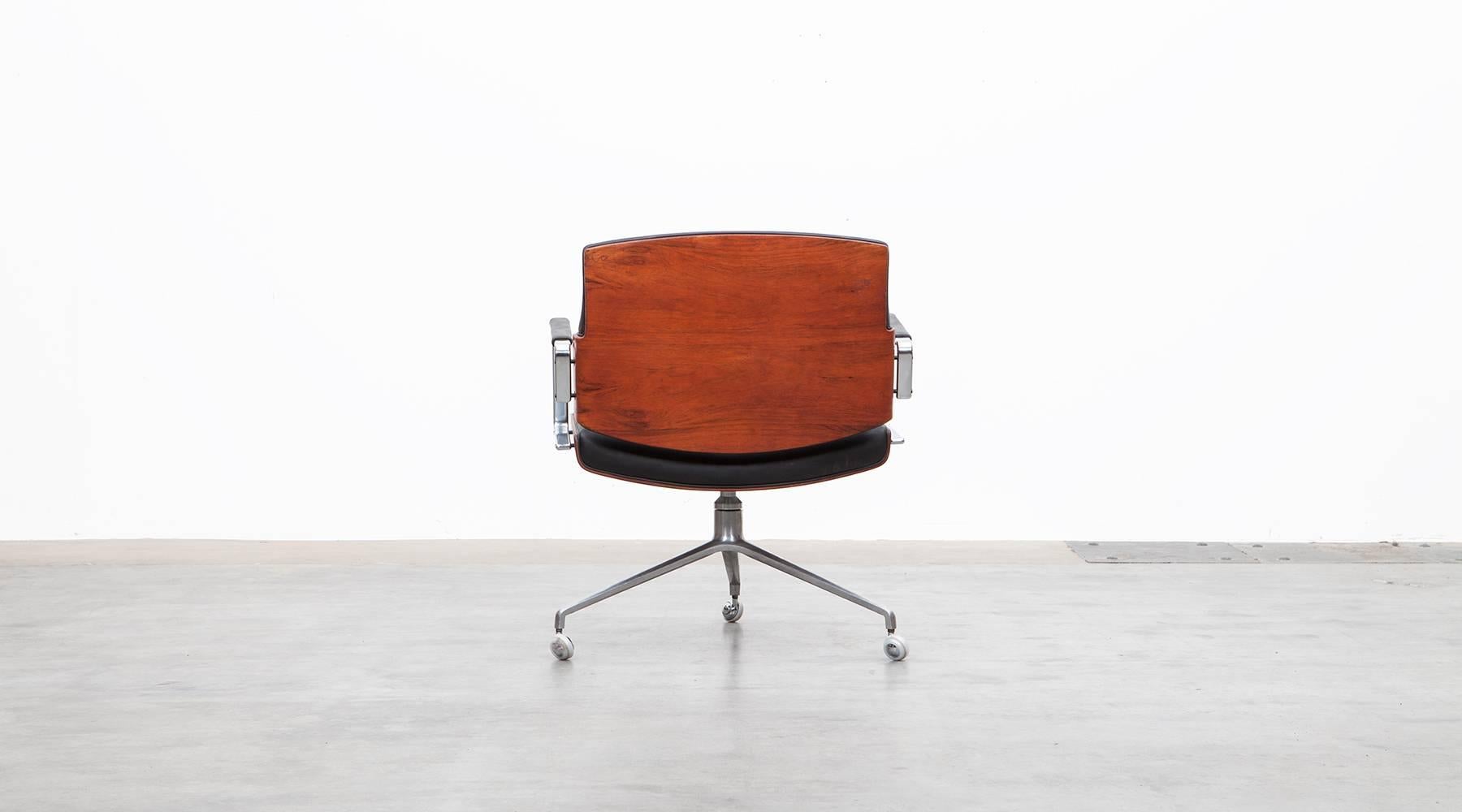 German 1960's brown wood and black leather Swivel Chair by Fabricius and Kastholm 'e'