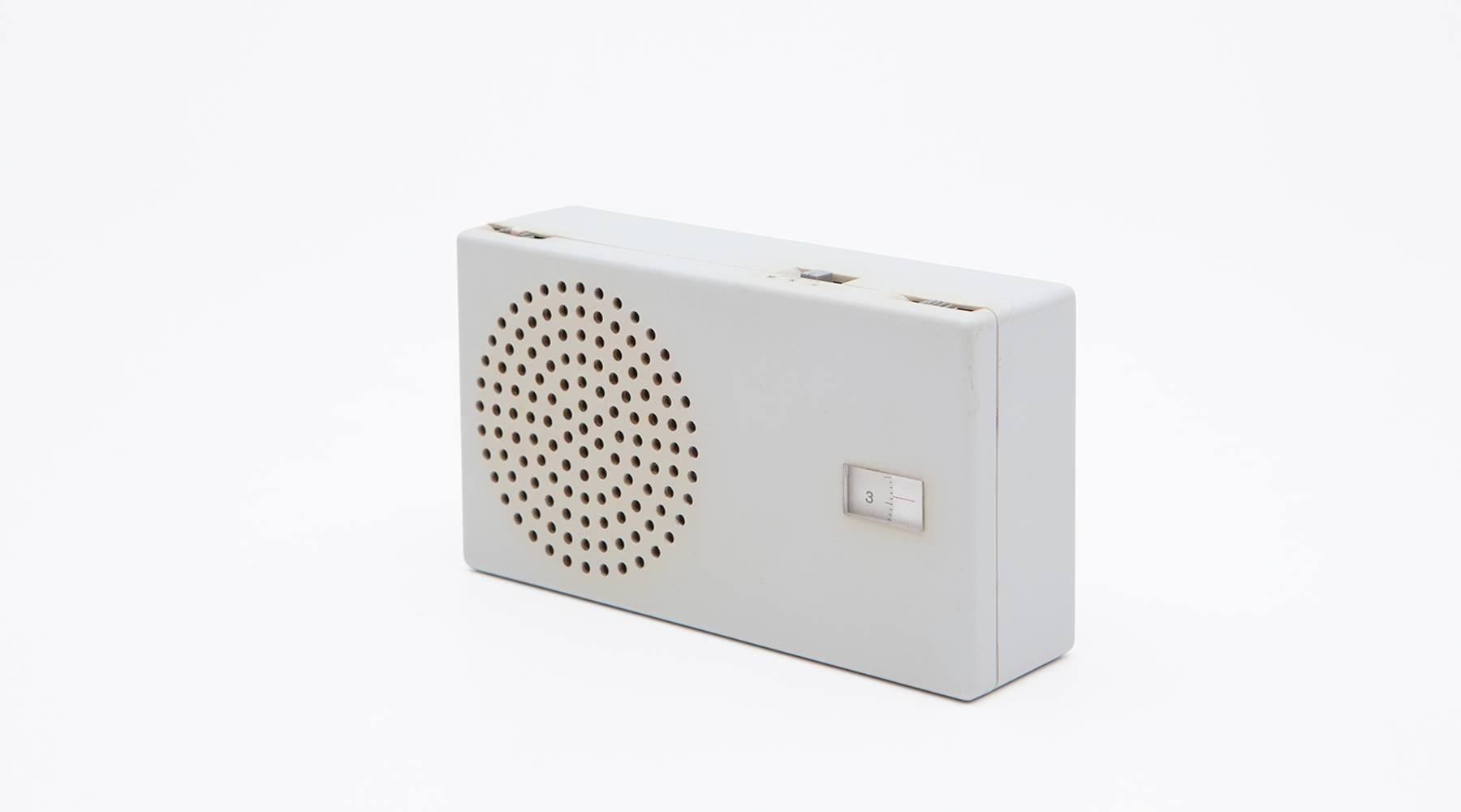 Spare modernist desk radio designed by Dieter Rams who is a German industrial designer of the modern age. The aim of his designs is the clarity of the form, material suitability and ease of use. This original and rare piece devoid of extraneous
