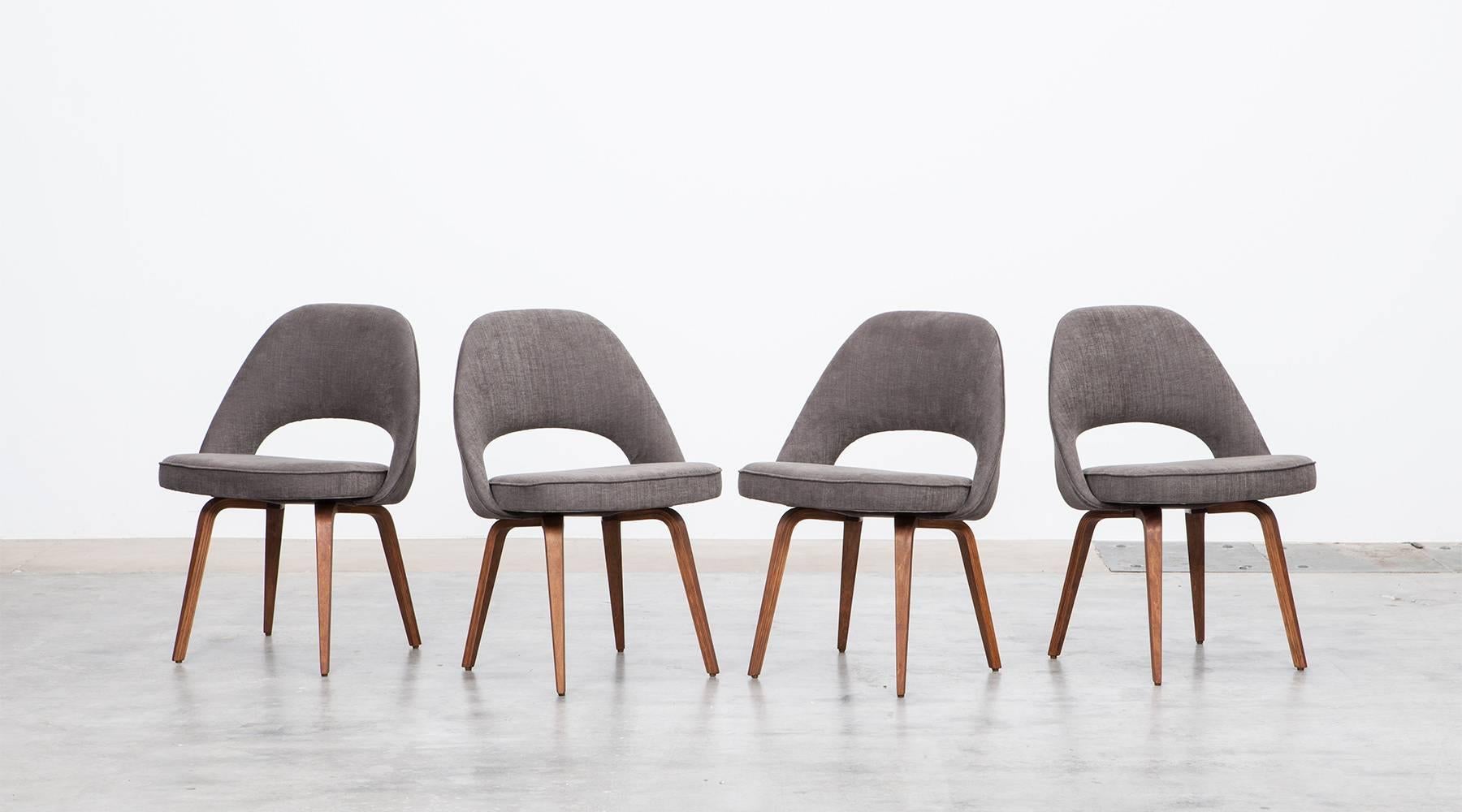 Set of six beautiful side chairs designed by Eero Saarinen. The chairs are recently newly upholstered in high-quality fabric. The wooden legs are all in outstanding condition. Manufactured in 1957 by Knoll International. *New Upholstery*

  