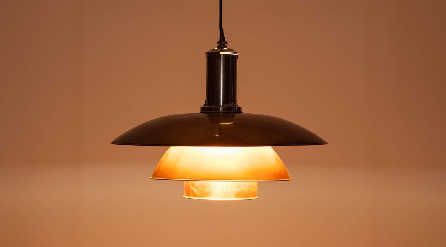 Very rare Ceiling Lamp of Poul Henningsen pendants with copper shades, a nickel-plated fitment and a glass shade just in front of the bulb for a soft, warm light. Designed by Poul Henningsen in the 1940s. The Lamp is in good conditions and has a
