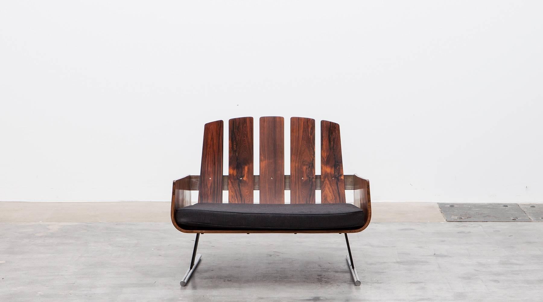 Rare pieces of Brazilian modern design. A pair of lounge chairs with arms are designed by Jorge Zalszupin in the 1960s. Constructed with Brazilian jacaranda with dramatic, contrasted grains. The chairs features beautiful profile from all angles.