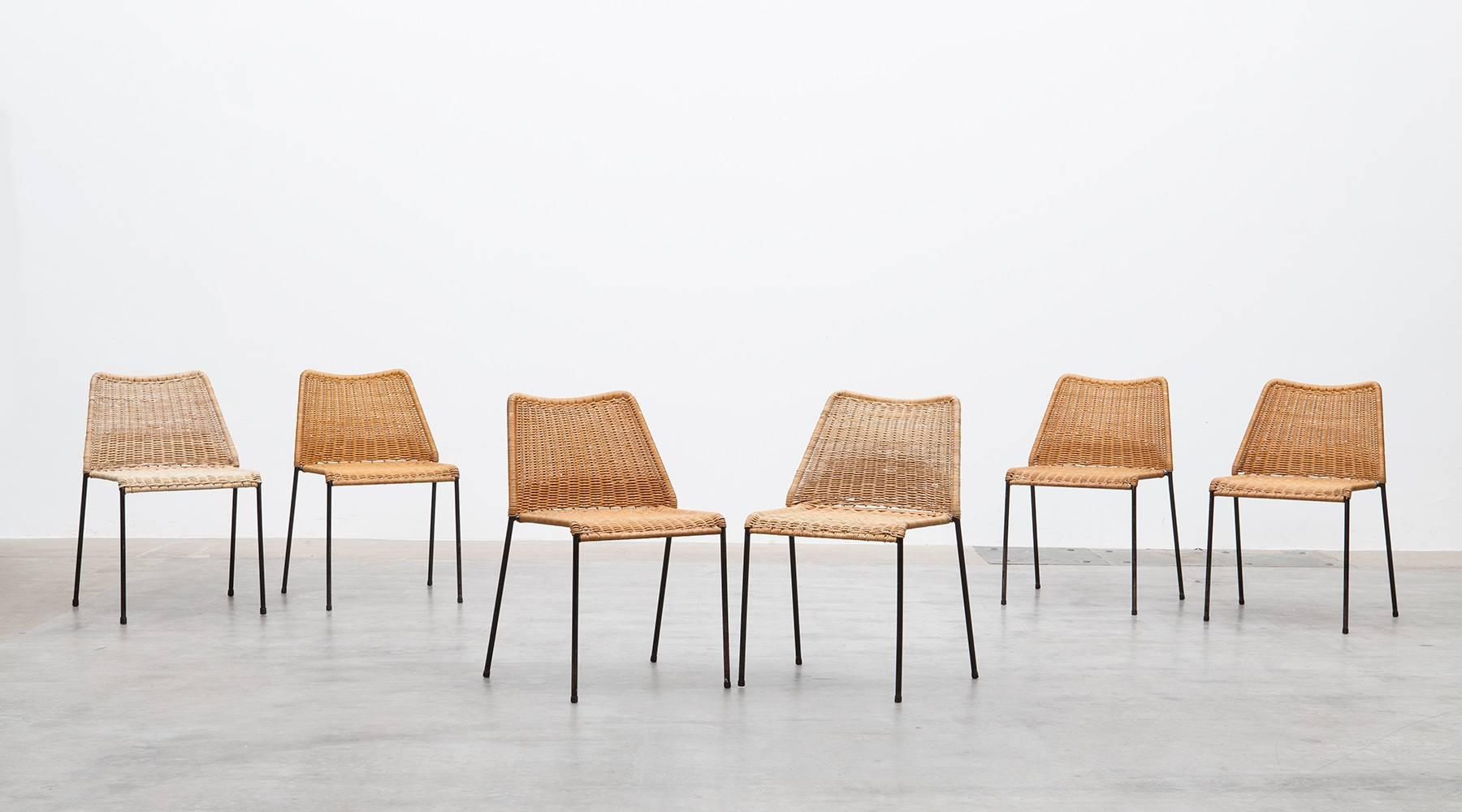 Very rare set of eight chairs in cane on black lacquered metal frame are designed by German architect Herbert Hirche who was a Student of Wassily Kandinsky and Ludwig Mies van der Rohe at the Bauhaus. Manufactured by Wilde+Spieth.