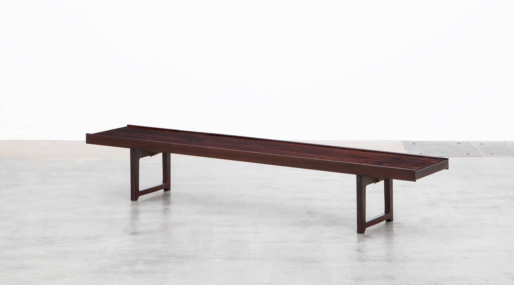 Clean-lined and solid long bench exemplary for Torbjorn Afdals designs. The bench can be also set up as coffee table and comes in exquisitely patterned wood with solid legs. Manufactured by Bruksbo. A further pair of benches in stock. 

Bruksbo