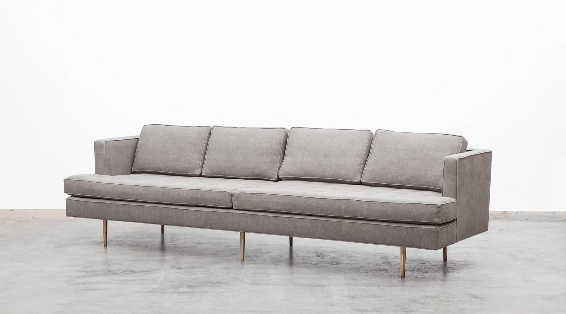 Six-leg Sofa, new upholstery, brass legs, Edward Wormley, USA, 1955.

Very rare sofa designed by Edward Wormley. The sofa comes with four back cushions and has a deep seat area for very comfortable relaxing. It simple but stunning design makes this