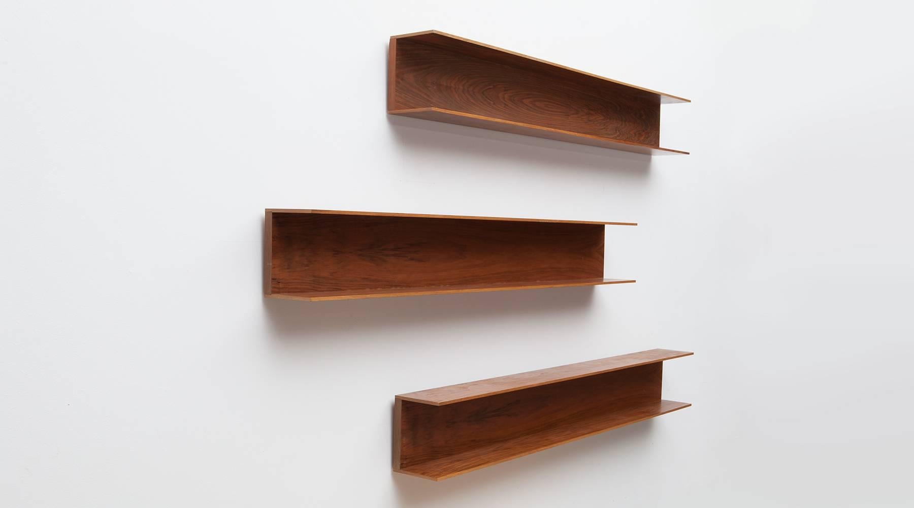 Set of three wall shelves designed by Walter Wirtz in wood. U-shaped structure in minimalistic German design from the early 1960s. The shelves are reworked and comes in very good condition. Manufactured by Wilhelm Renz.