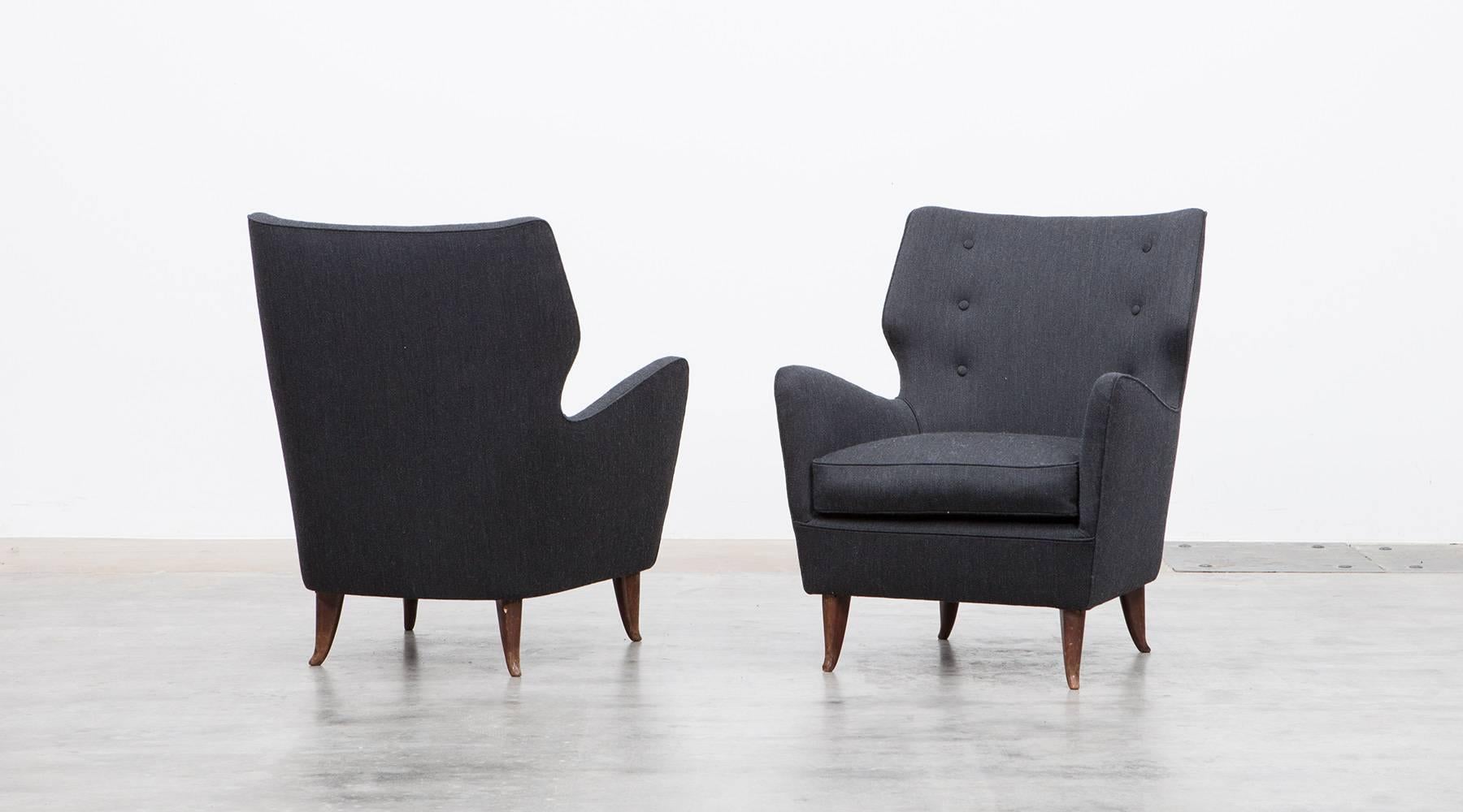 Set of Armchairs, Gio Ponti, new upholstery, Italy, 1949

A pair of lounge chairs designed by Gio Ponti. Its sensual curves and the elegantly tapered legs give the chairs a sculptural and modern look and feel. These sumptuous lounge chairs are in