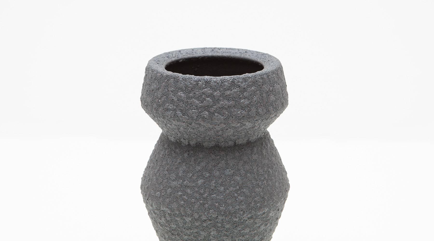 Nicely shaped, monochrome vase designed and produced by German artist Martin Schlotz. Martin Schlotz works in thematic series. In variations of a certain type of shape. Available as a single object or in a set of three.