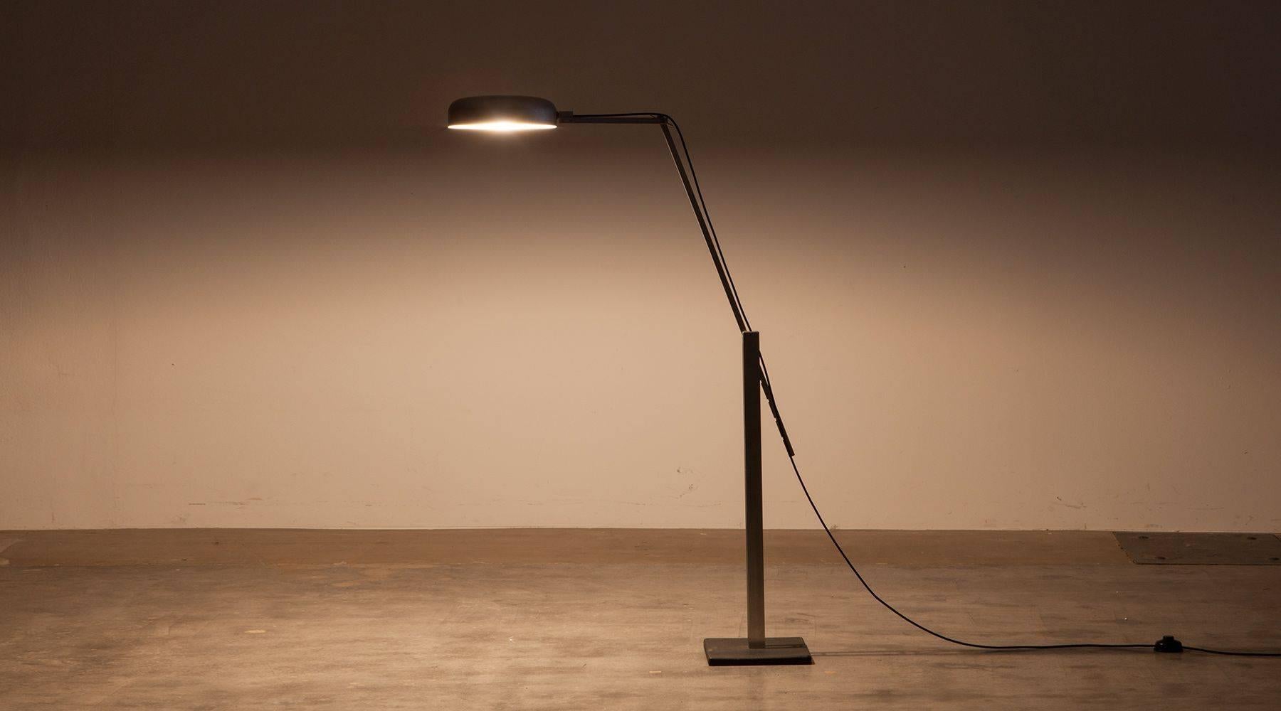 Fridtjof Schliephacke floor lamp basic construction of the lamp is designed for an industrial production. On the base in the form of a cast iron plate stand two aluminum columns, which are connected by bolts at three heights. The top part of the arm
