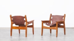 19702 brown leather and wood Lounge Chairs by Sergio Rodrigues