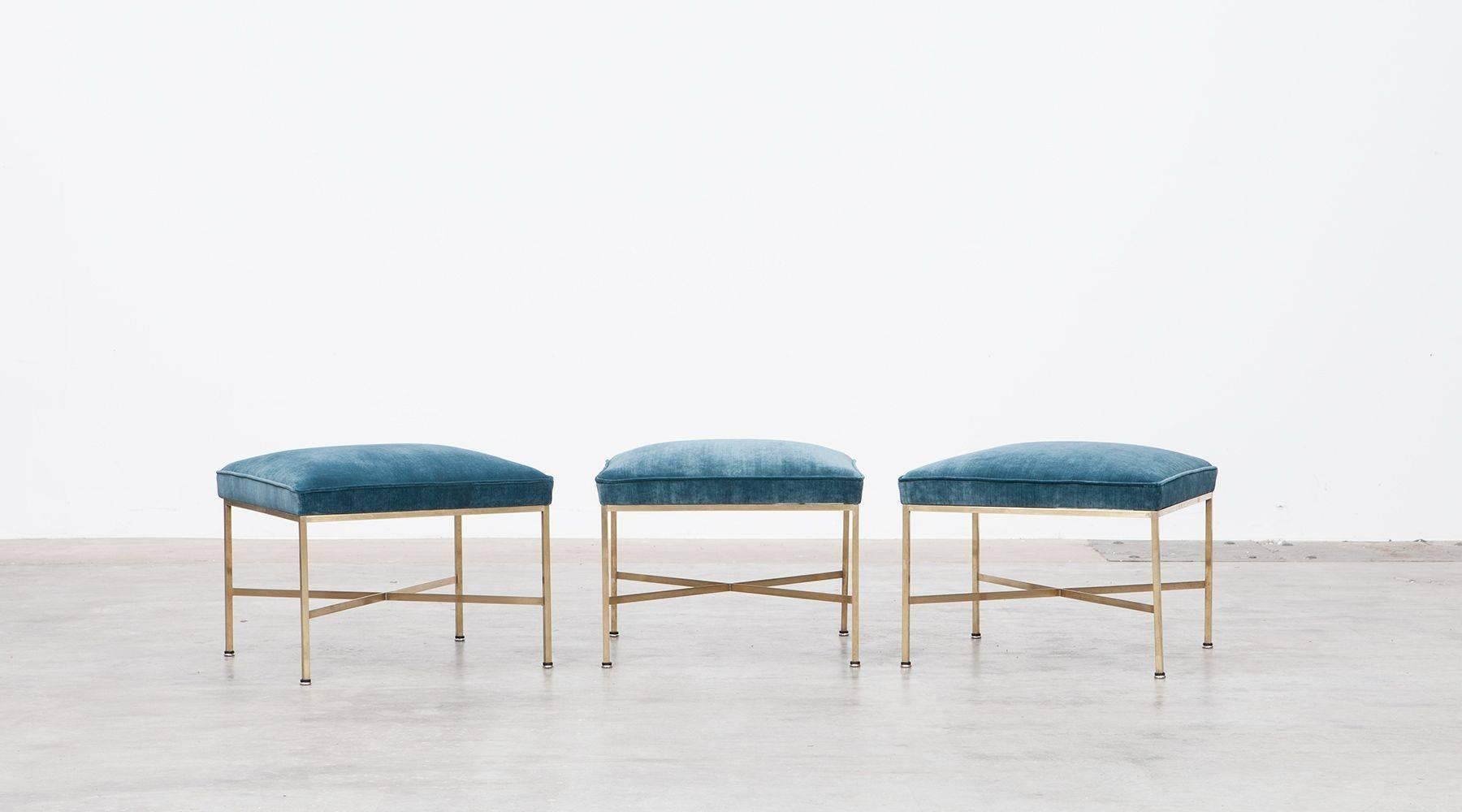 Beautiful and elegant set of three Paul McCobb stools. The solid brass square tubing is polished to a beautiful luster. The seats are newly upholstery with high-quality fabric. Wonderful examples of this design. Manufactured by Directional. 

