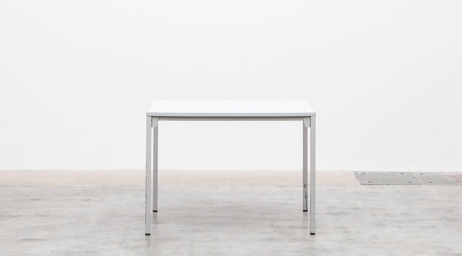 This table was designed by German modernist Ferdinand Kramer in 1959 for Johann-Wolfgang-Goethe University in Frankfurt am Main. It has a laminated top hold by a metal base. Manufactured by Otto Kind.

Ferdinand Kramer was a German modernist chosen