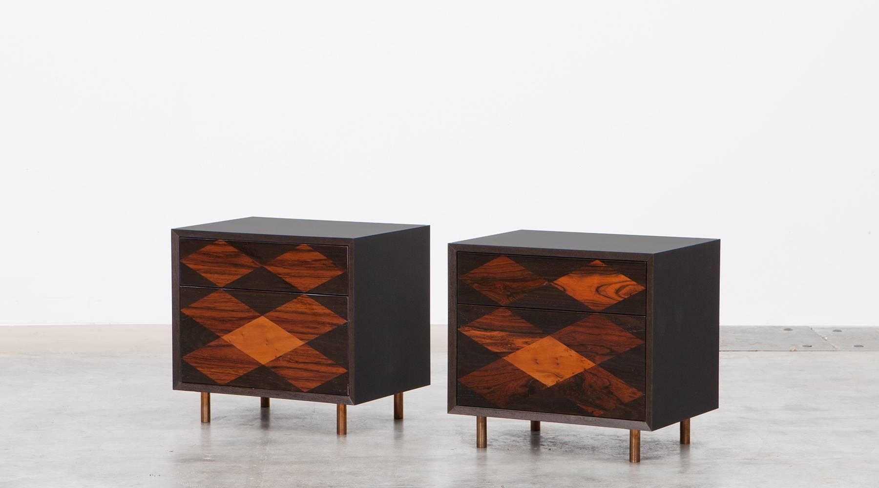 Pair of nightstands by contemporary German artist Johannes Hock, veneered drawer tops in diamond pattern, 30 types of wood. Each case contains two drawers, one bigger and one smaller and stands on bronze feet. Matching cabinet with same pattern