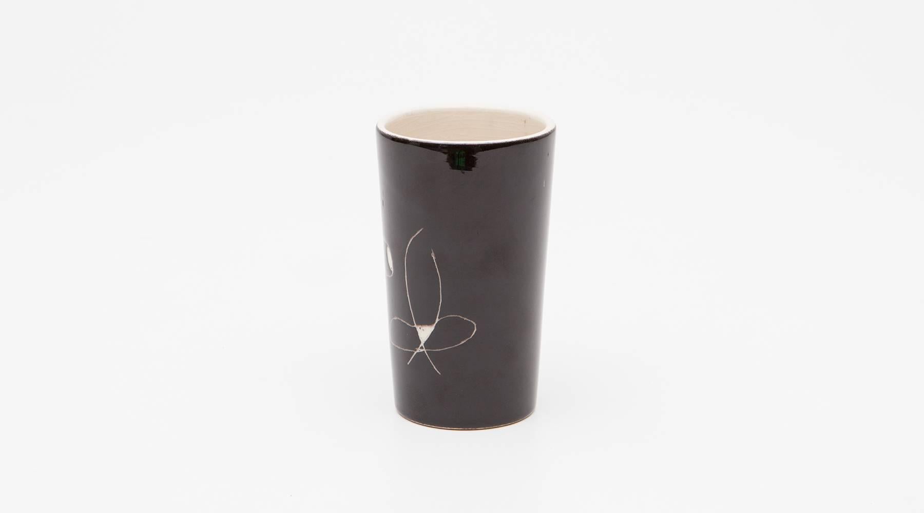 Black and white ceramic Cup by famous Joan Miró. Miró was a Spanish painter, sculptor, and ceramicist born 1893 in Barcelona. Earning international acclaim, his work has been interpreted as Surrealism, a sandbox for the unconscious mind, a